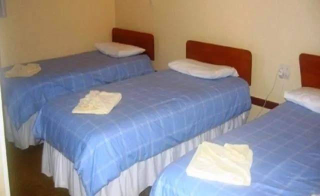 Bed in Glow Worm Motel