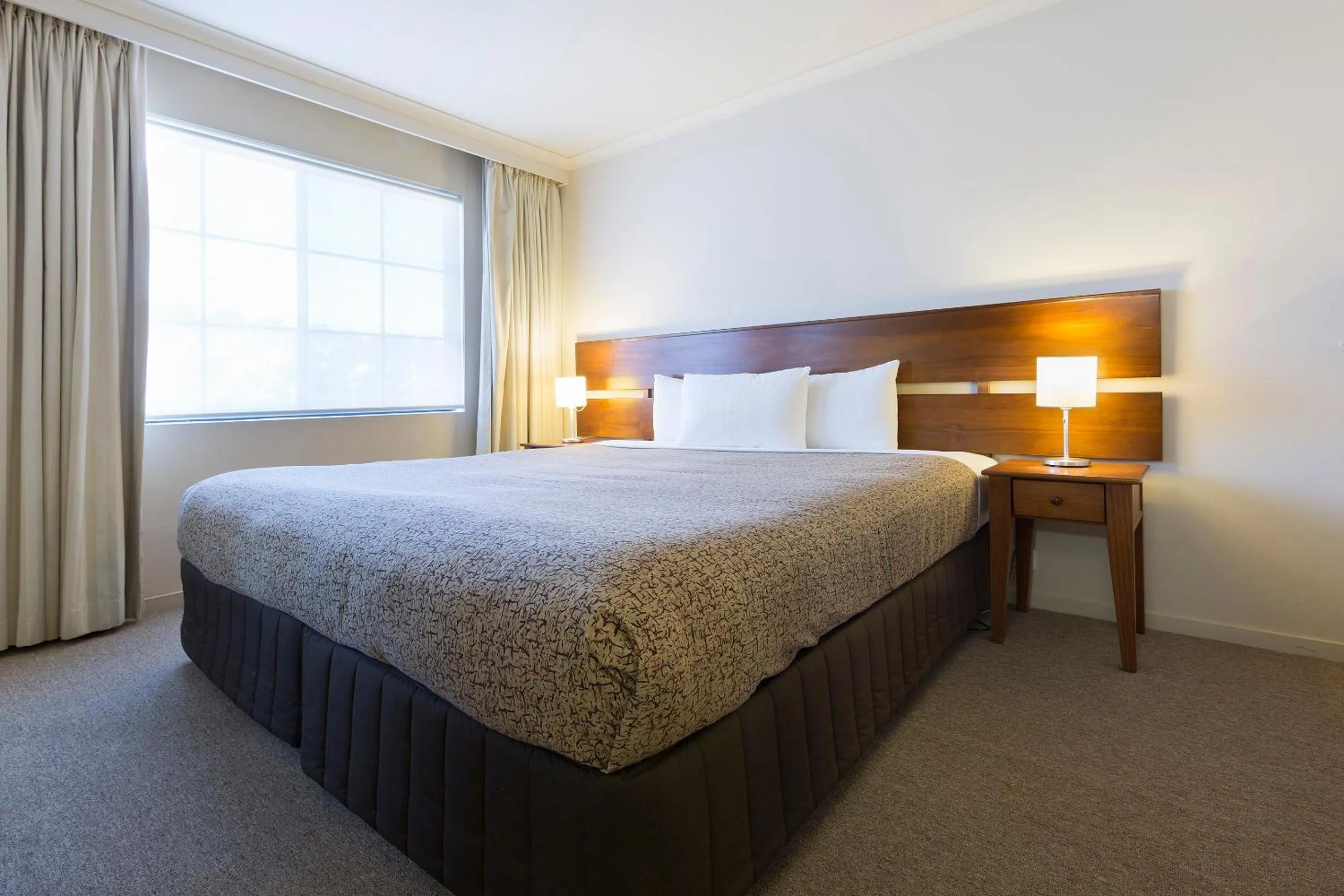 Bedroom, Bed in Canberra Parklands Central Apartment Hotel Official