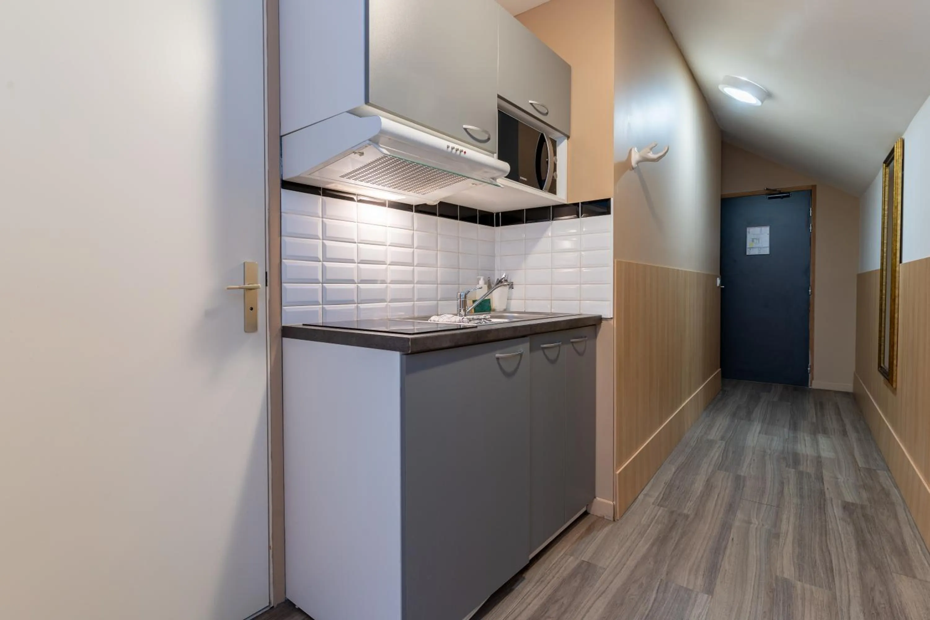 kitchen in CALM Appart' & Hostel