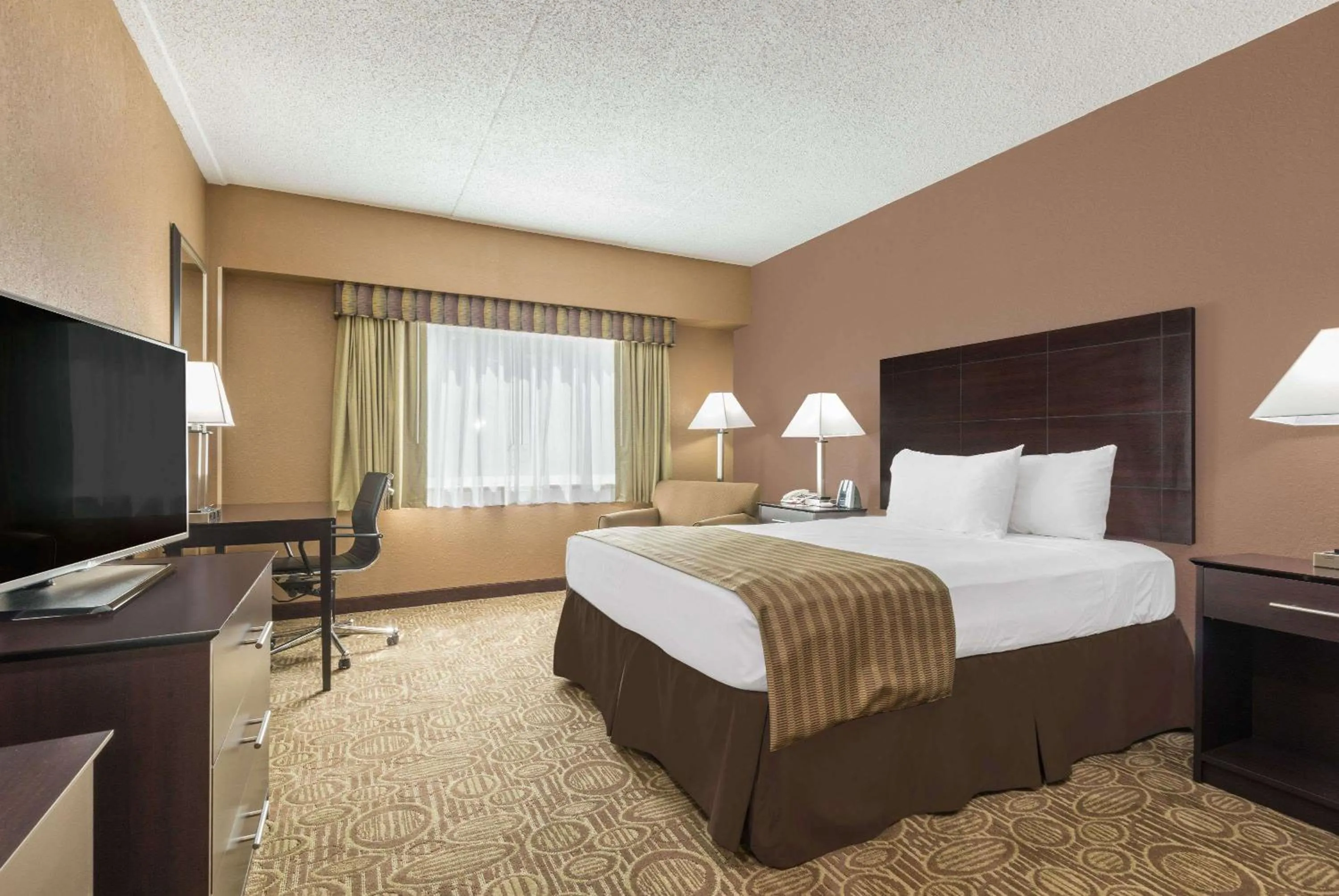 Photo of the whole room, Bed in Ramada by Wyndham Paintsville Hotel & Conference Center