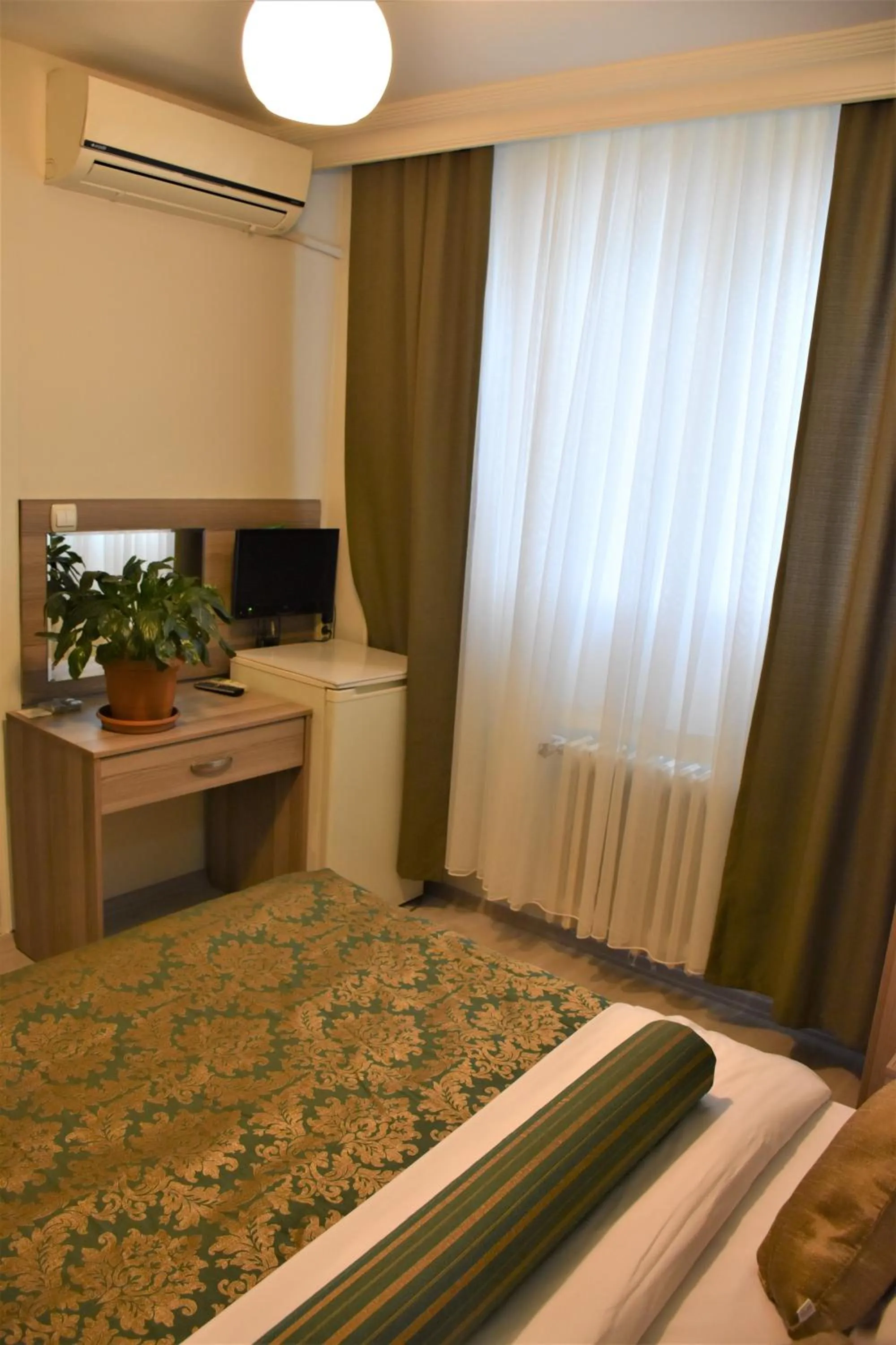Bed in DİNAR HOTEL