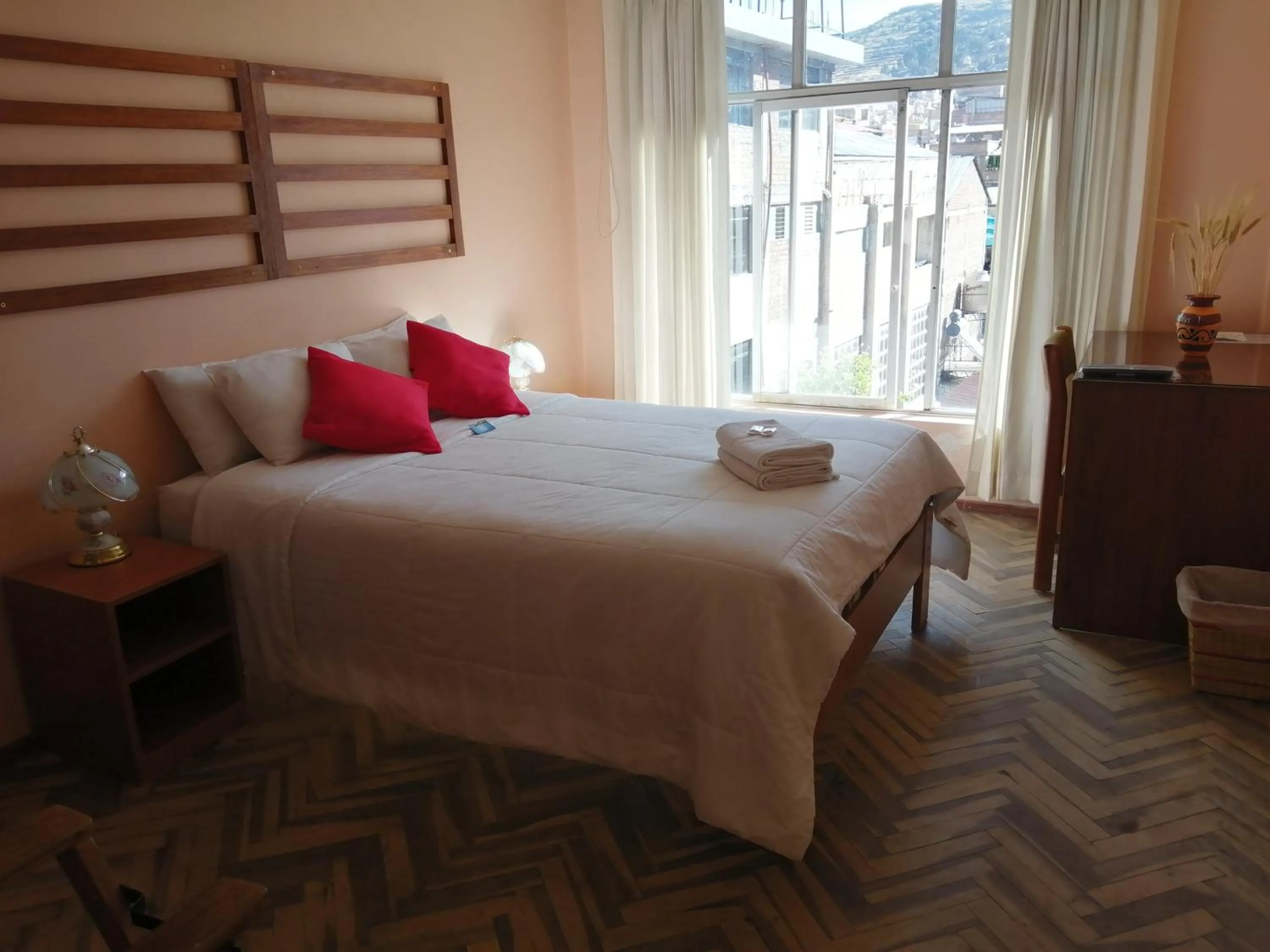 Bed in Huaytusive Inn Hotel