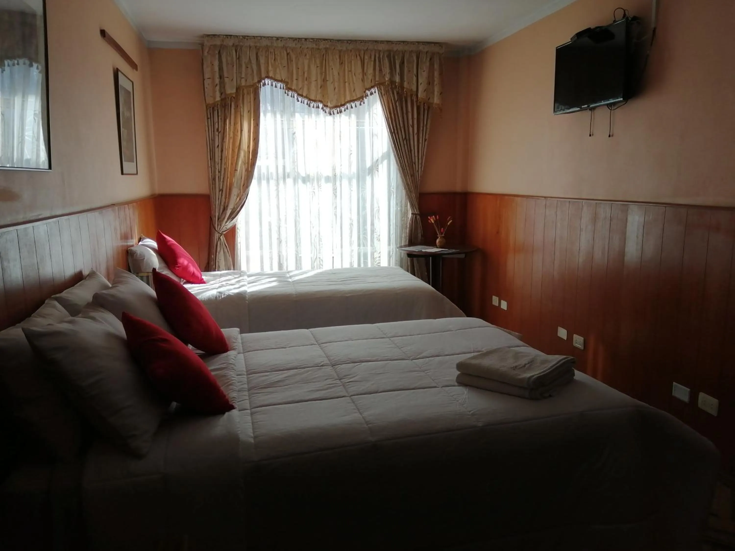 Photo of the whole room, Bed in Huaytusive Inn Hotel