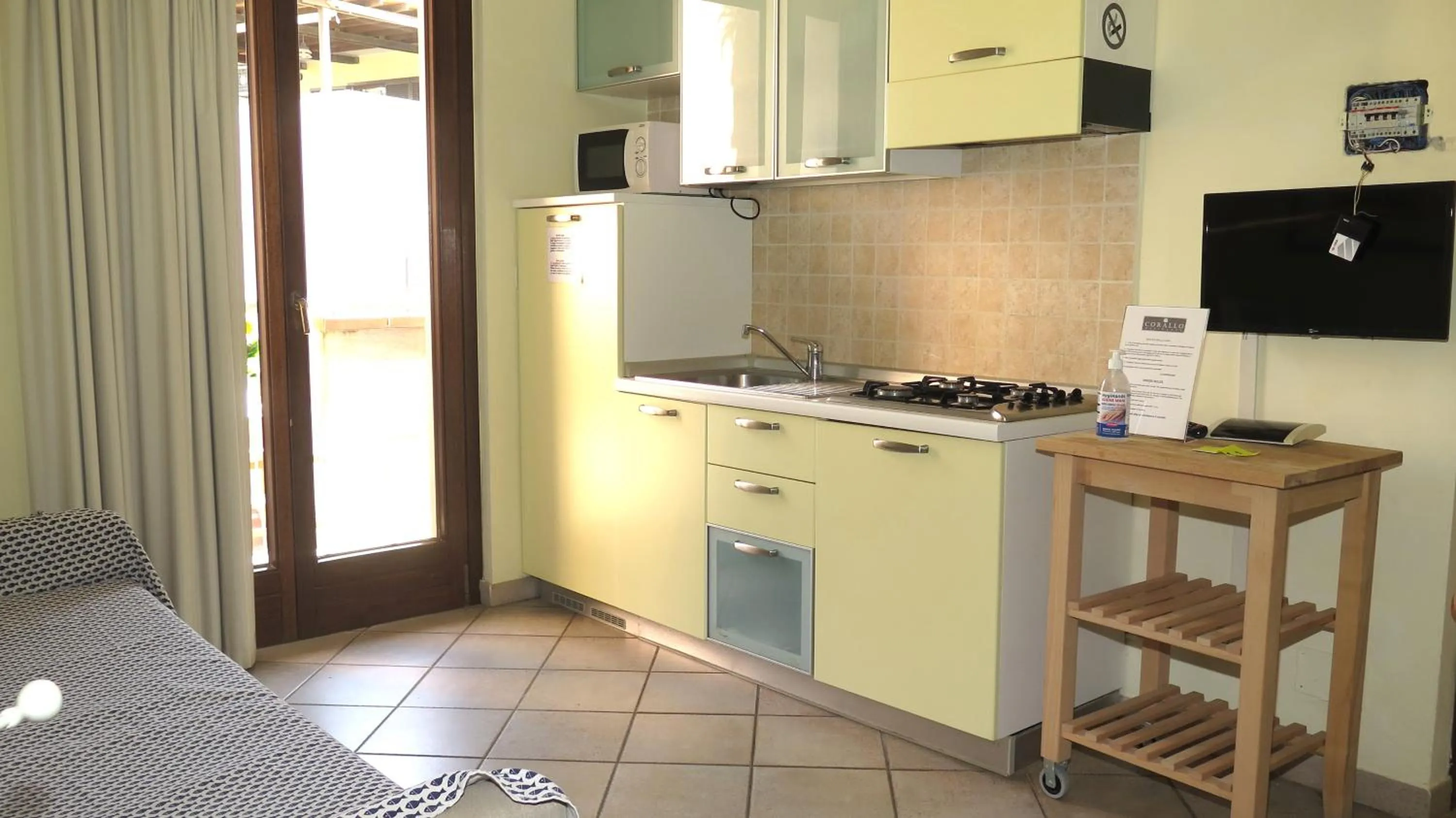 Kitchen or kitchenette in Residenza Turistico Alberghiera Corallo