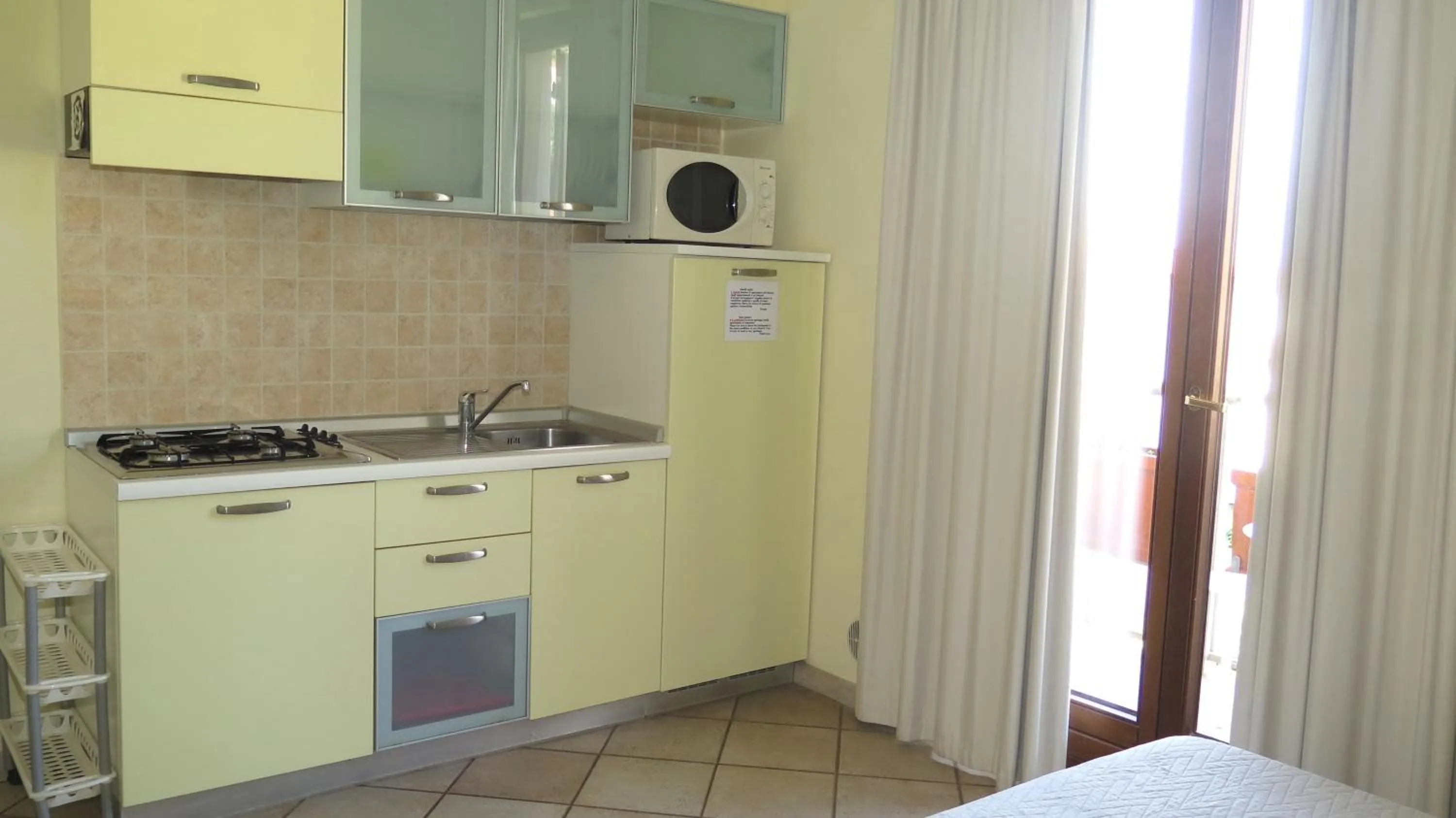 Kitchen or kitchenette in Residenza Turistico Alberghiera Corallo