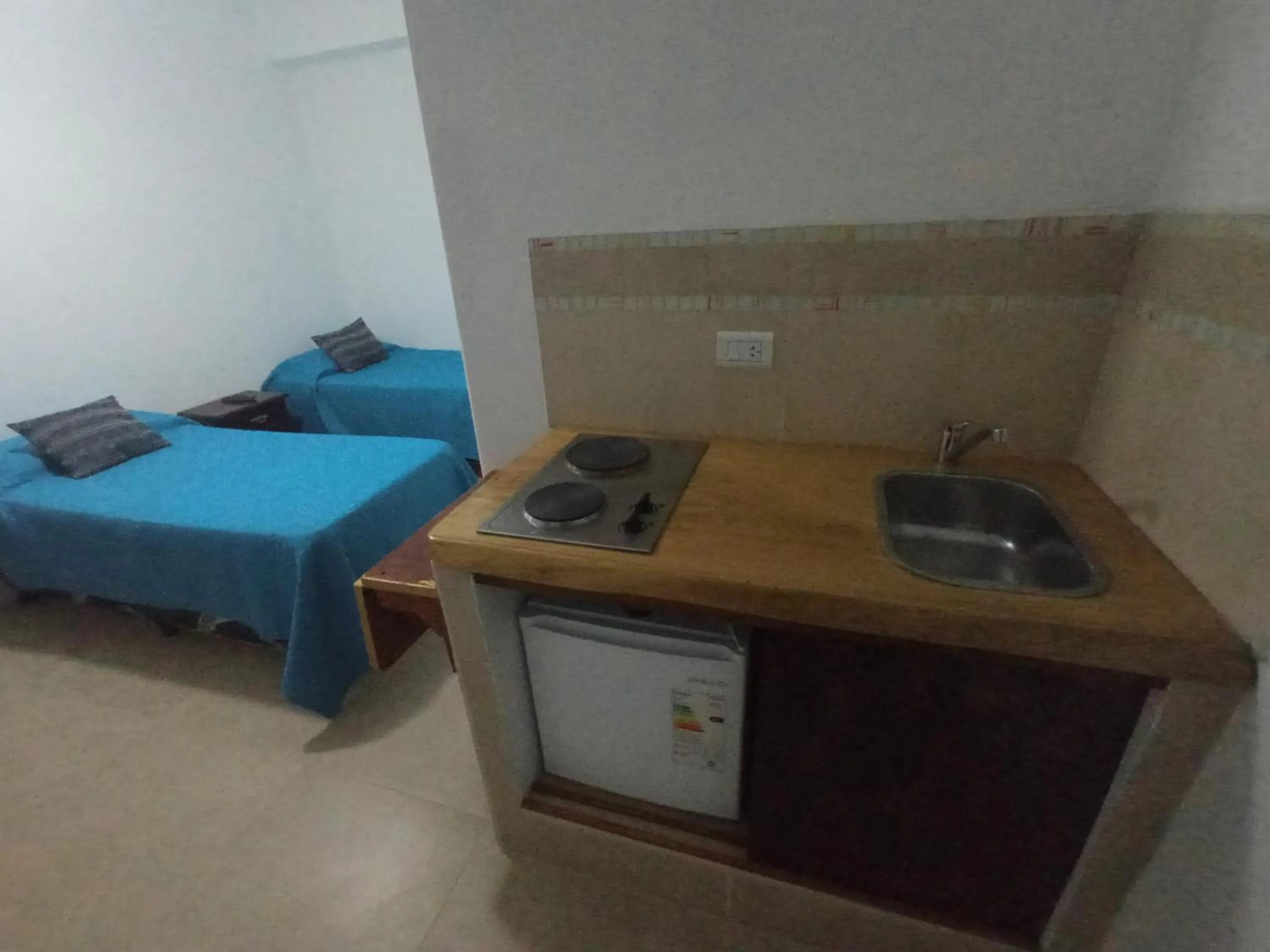 Kitchen or kitchenette, Bed in Divina Presencia