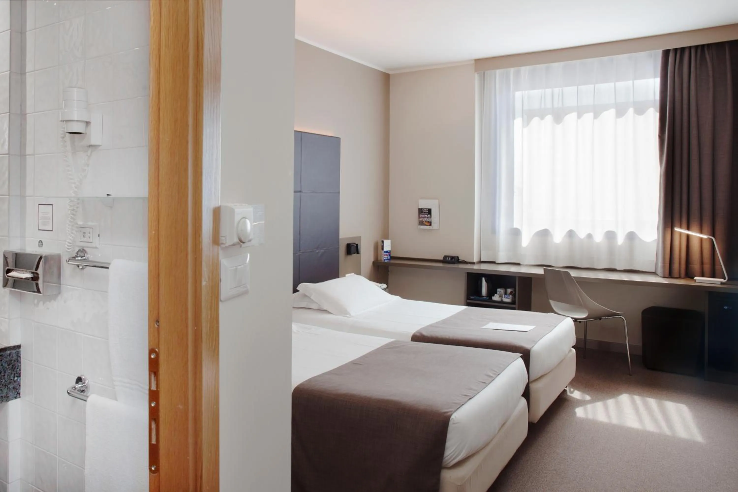 Bed in City Hotel & Suites