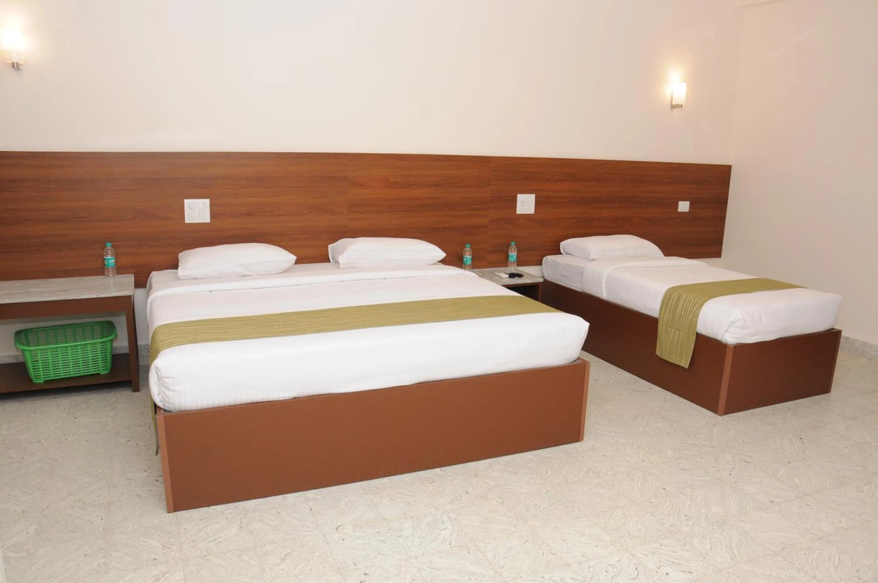 Bed in Sreeparthi Hotel