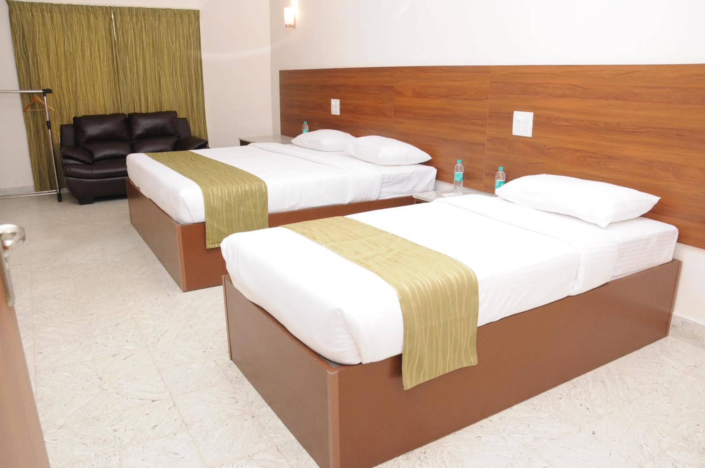 Bed in Sreeparthi Hotel