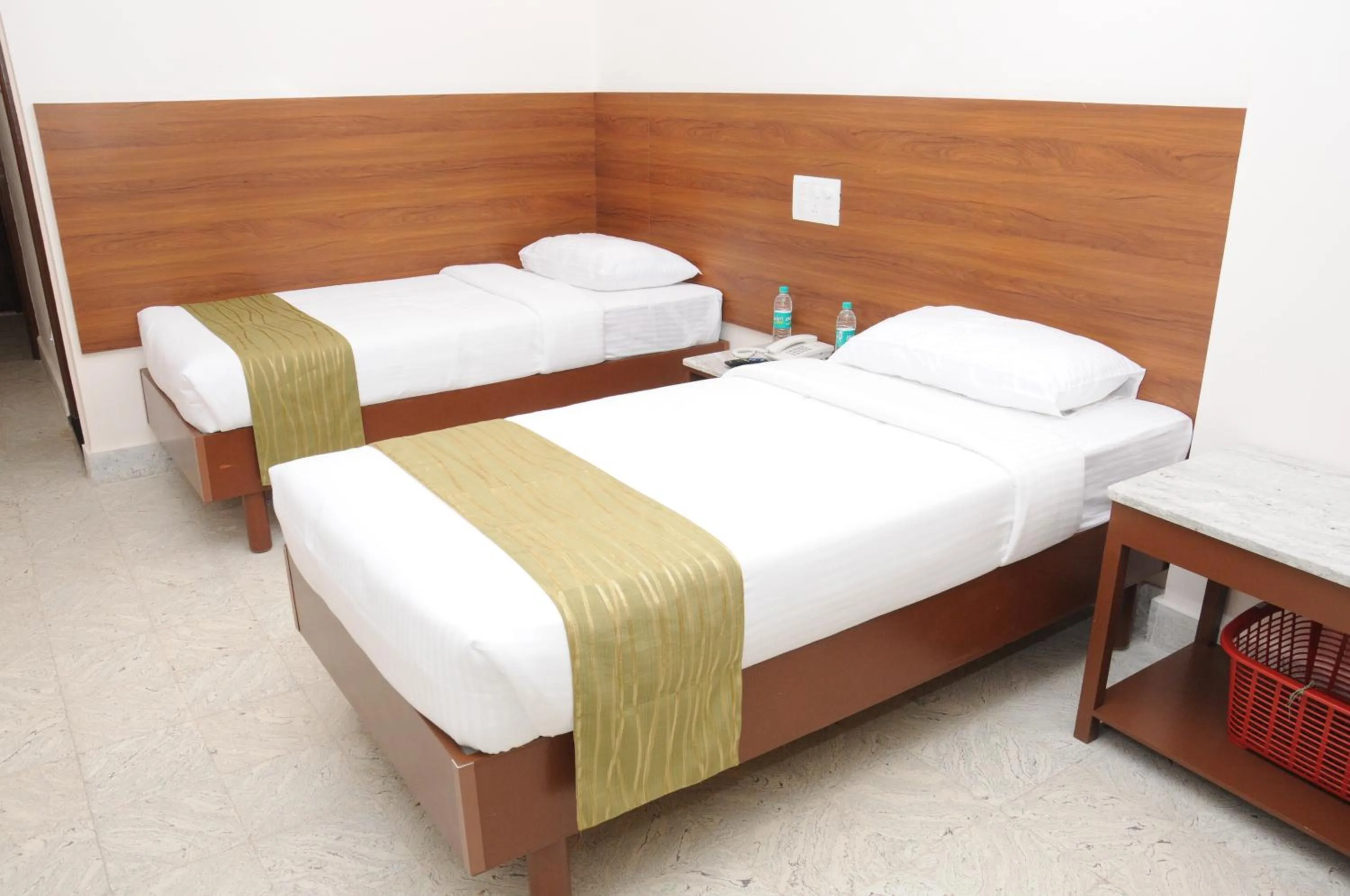 Bed in Sreeparthi Hotel