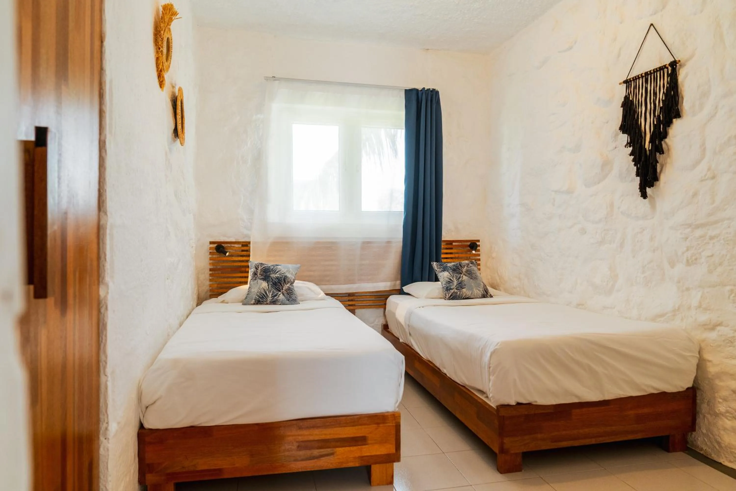 Bed in Casuarina Resort and Spa