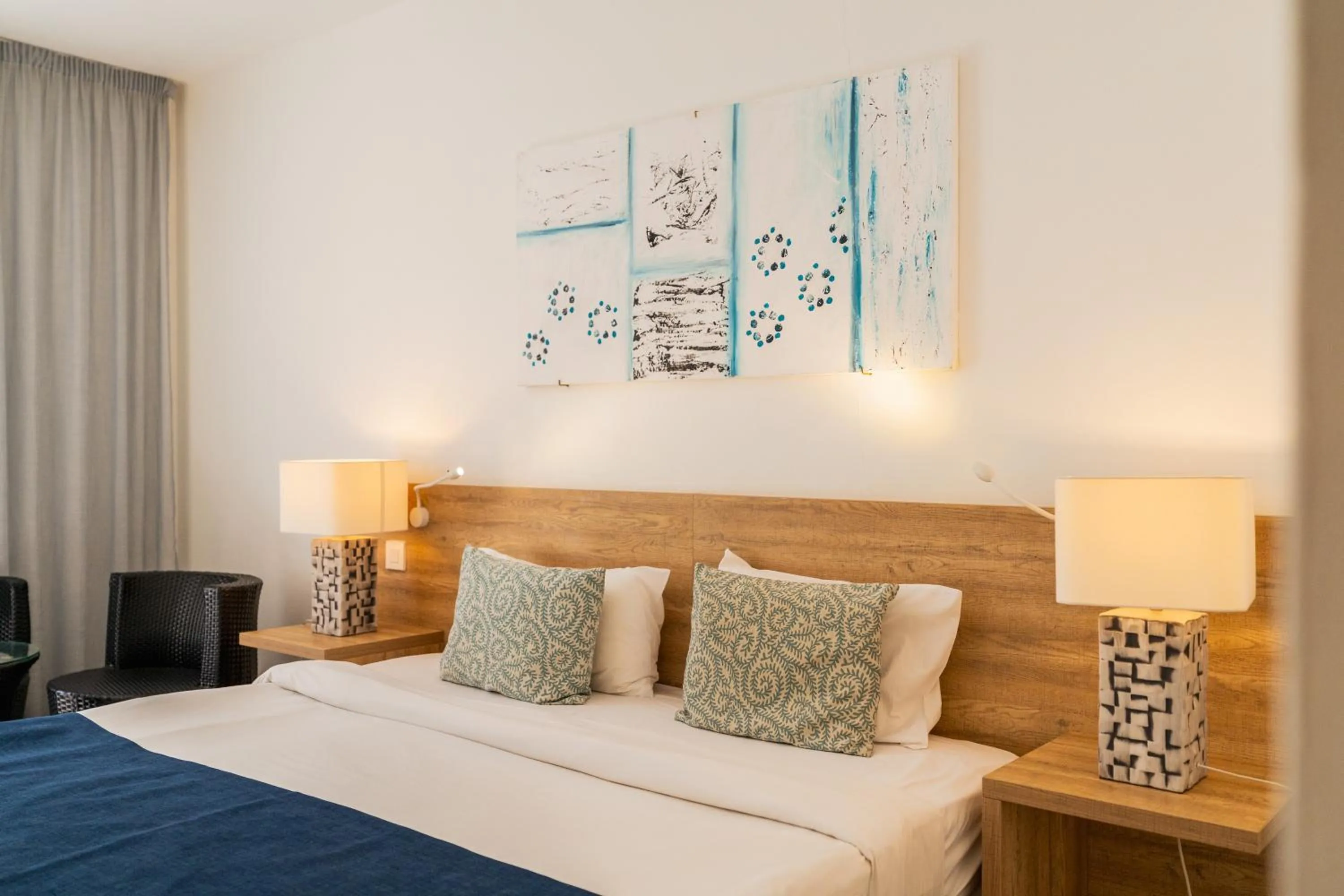 Bed in Casuarina Resort and Spa