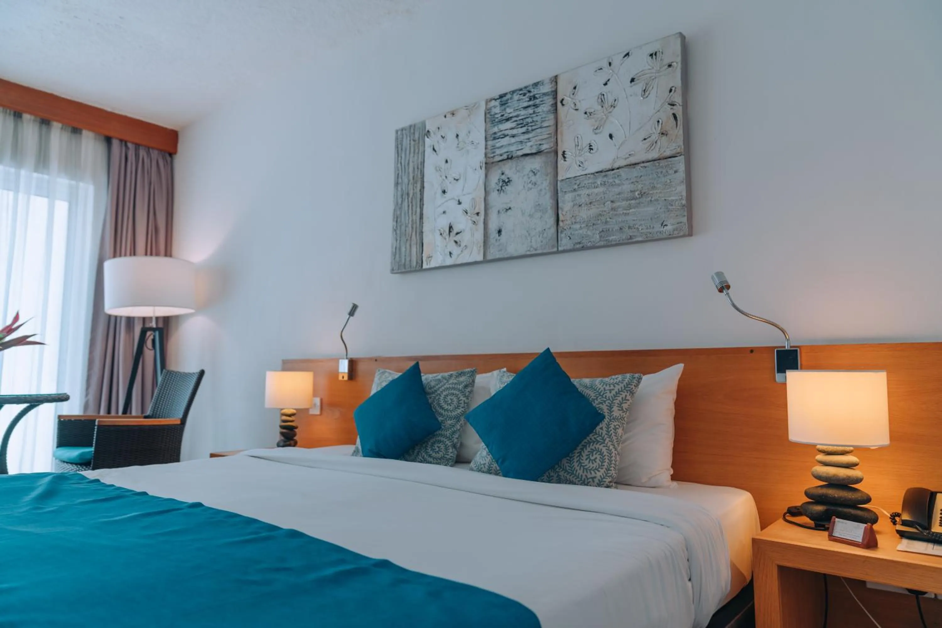 Bed in Casuarina Resort and Spa