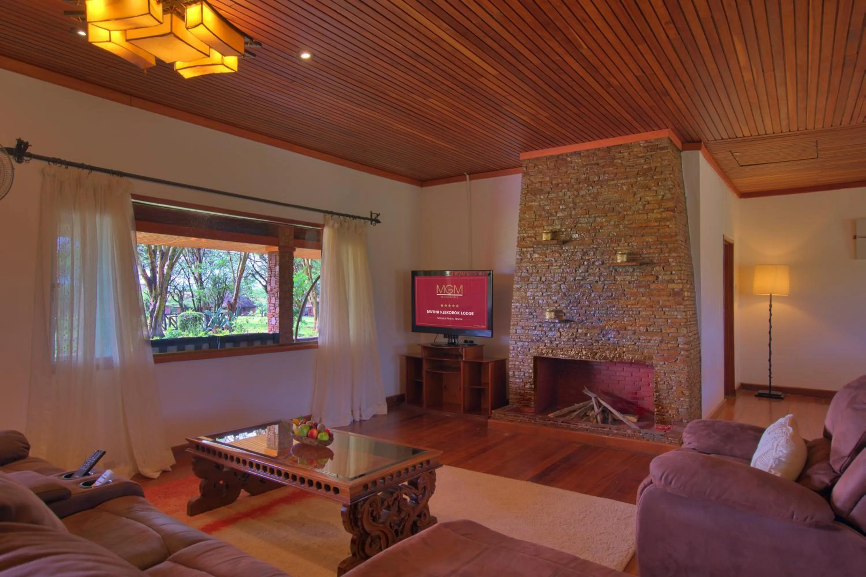 Communal lounge/ TV room in Muthu Keekorok Lodge, Maasai Mara, Narok