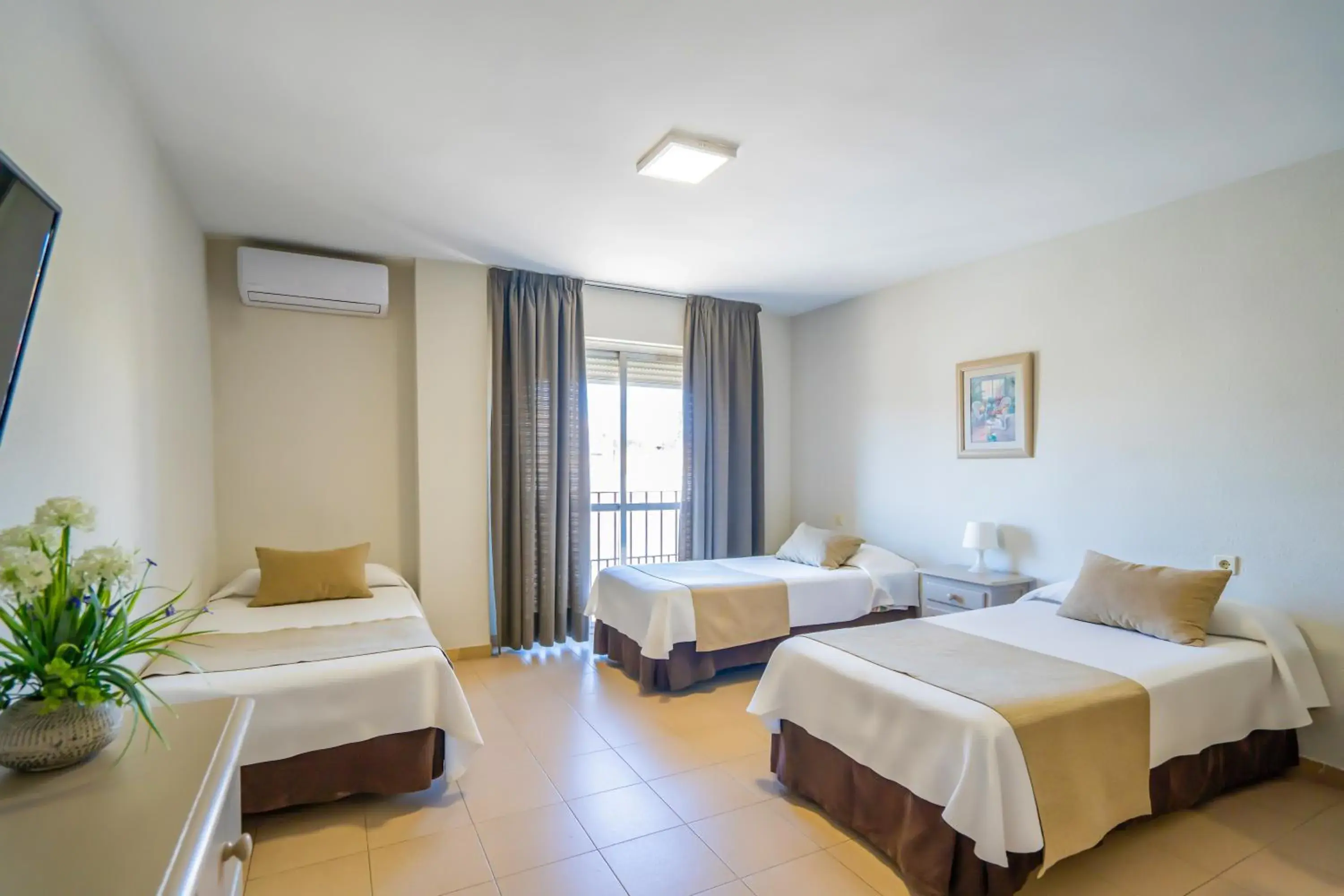 Photo of the whole room, Bed in Apartamentos Puerta del Sur Photo of the whole room, Bed in Apartamentos Puerta del Sur