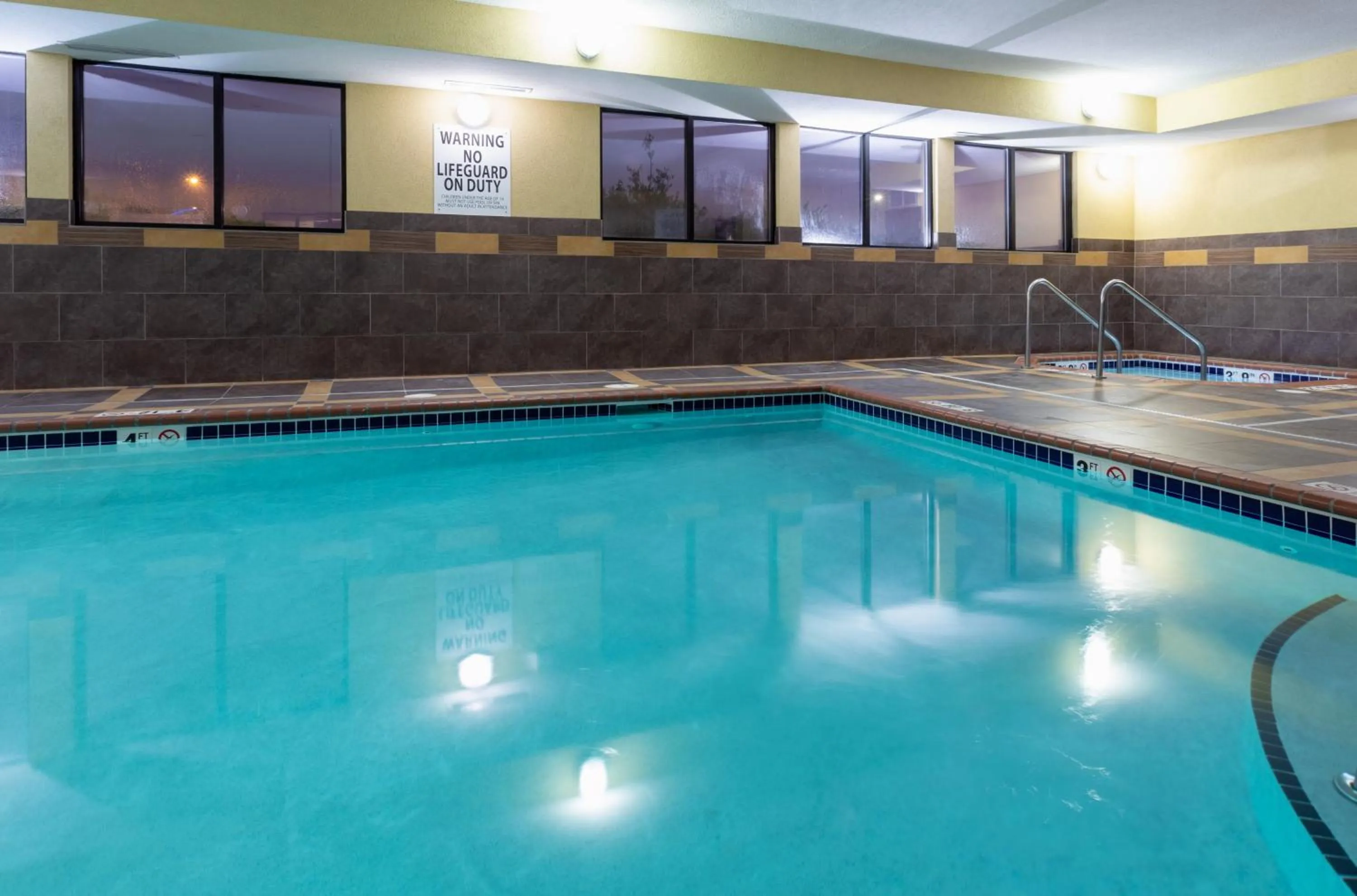 Swimming pool in Holiday Inn Express and Suites Rochester West-Medical Center by IHG