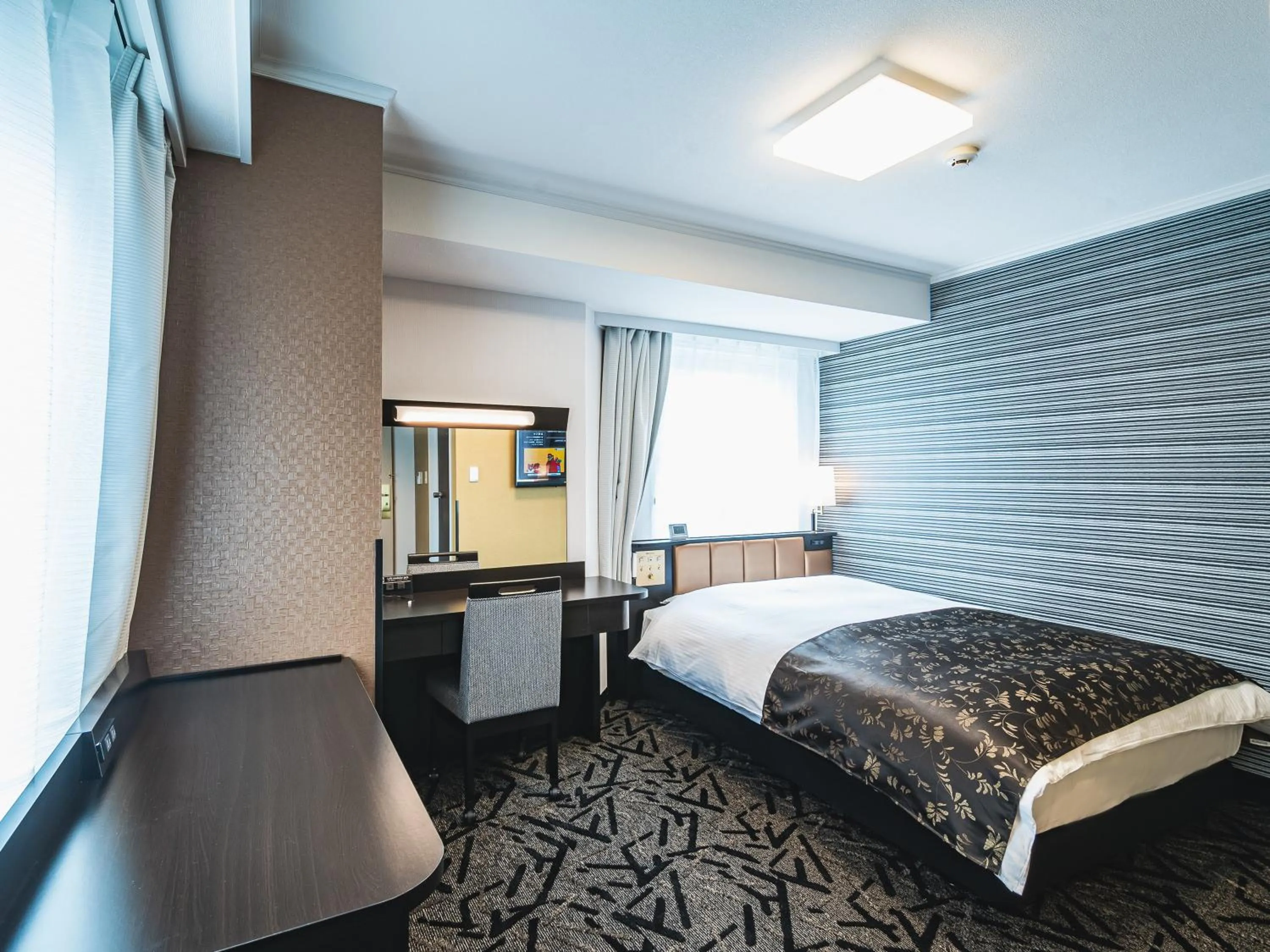 Bed in APA Hotel Sapporo-Susukino-Ekiminami