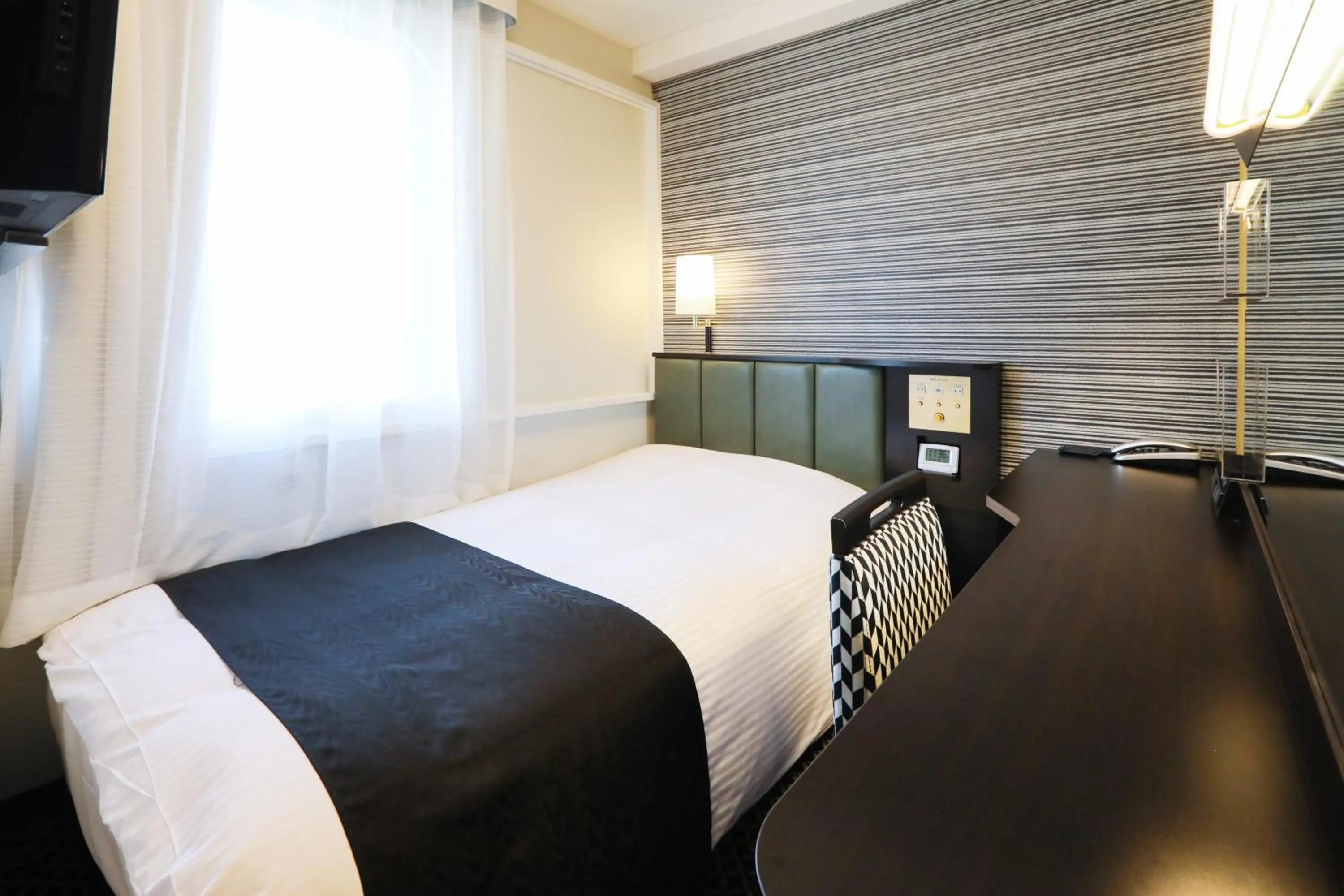 Photo of the whole room, Bed in APA Hotel Sapporo Susukino Ekimae