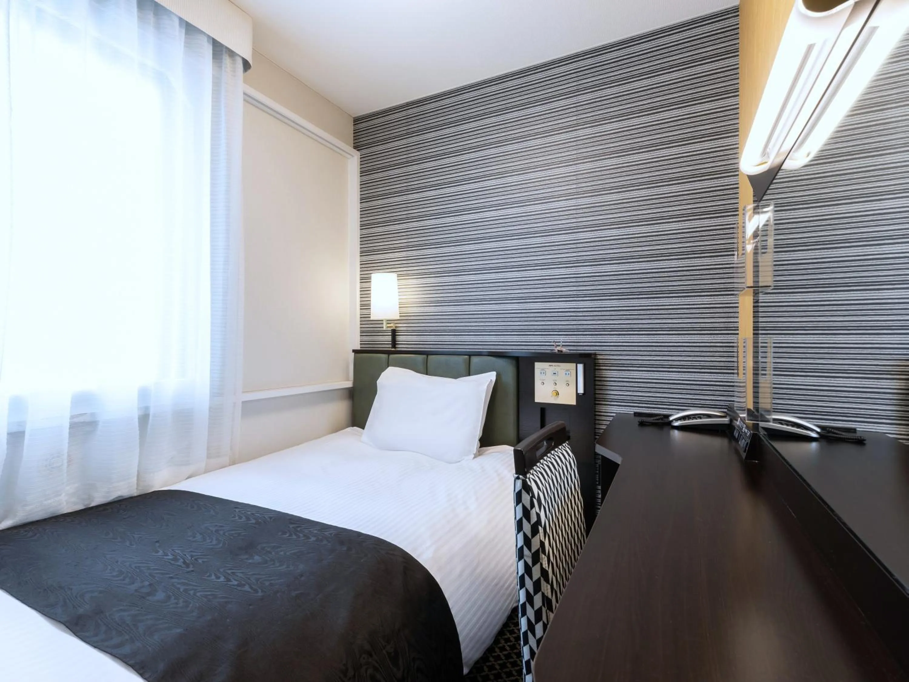 Photo of the whole room, Bed in APA Hotel Sapporo Susukino Ekimae