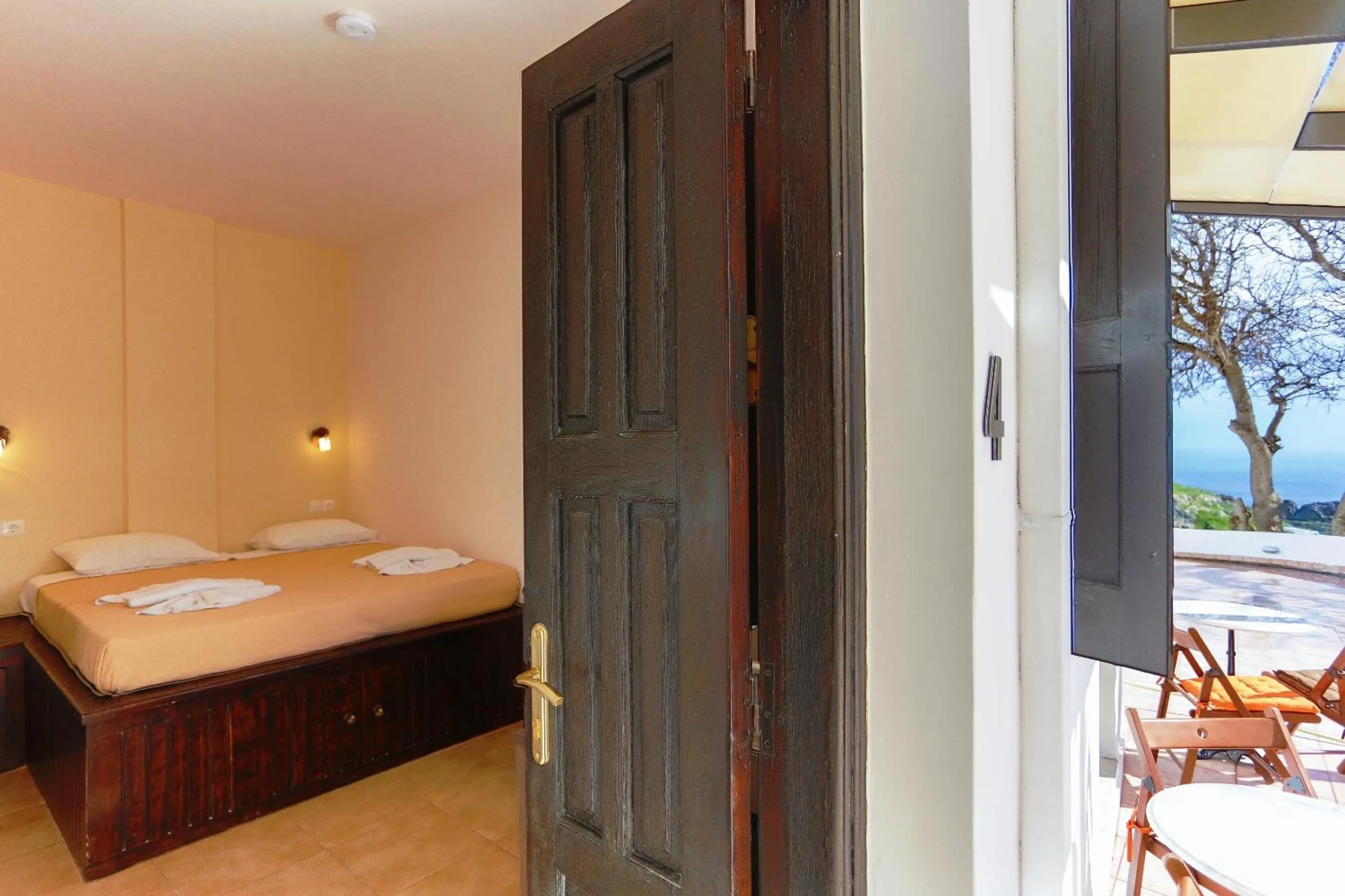 Bed in Little Lindos Sea View Studios