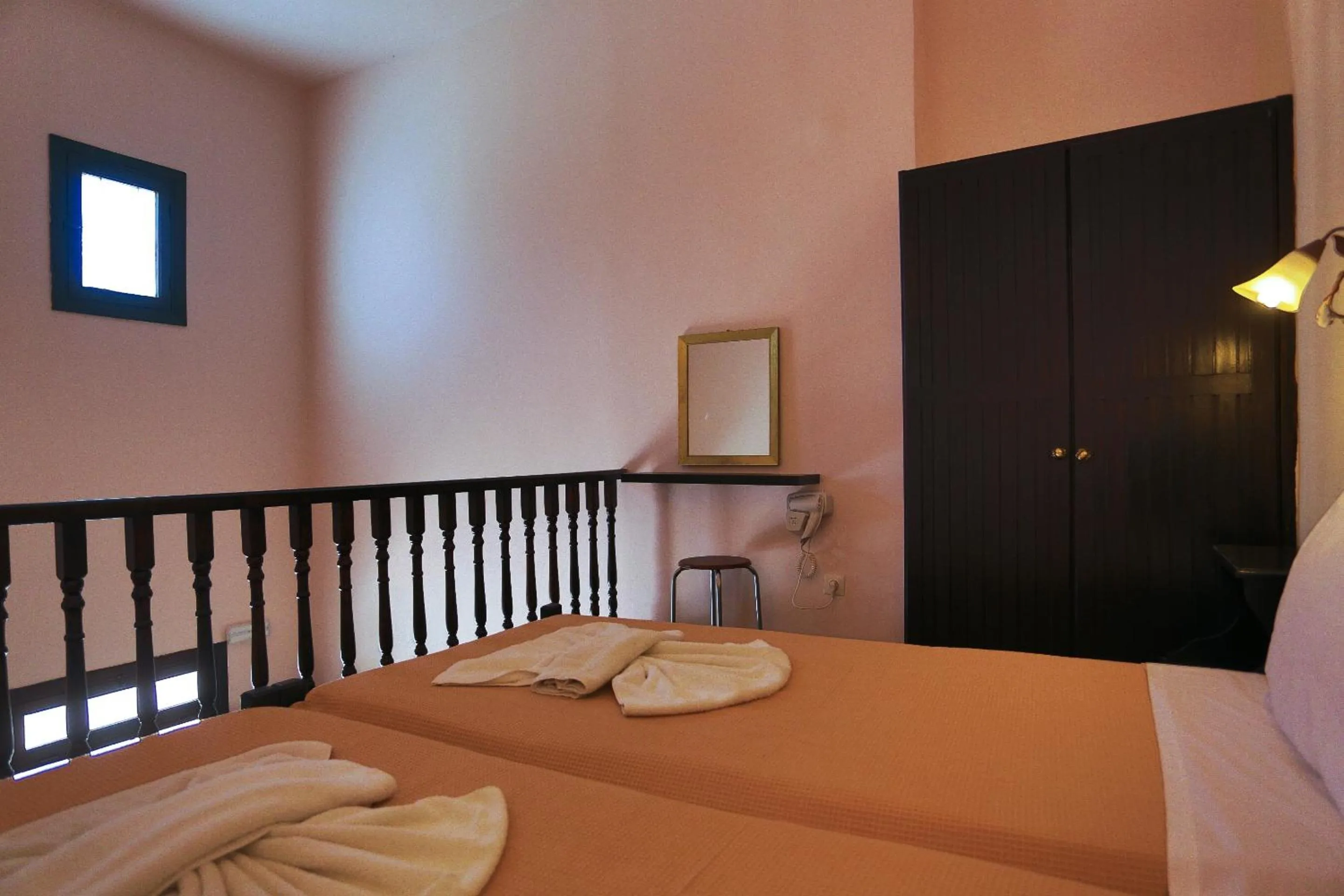 Bed in Little Lindos Sea View Studios