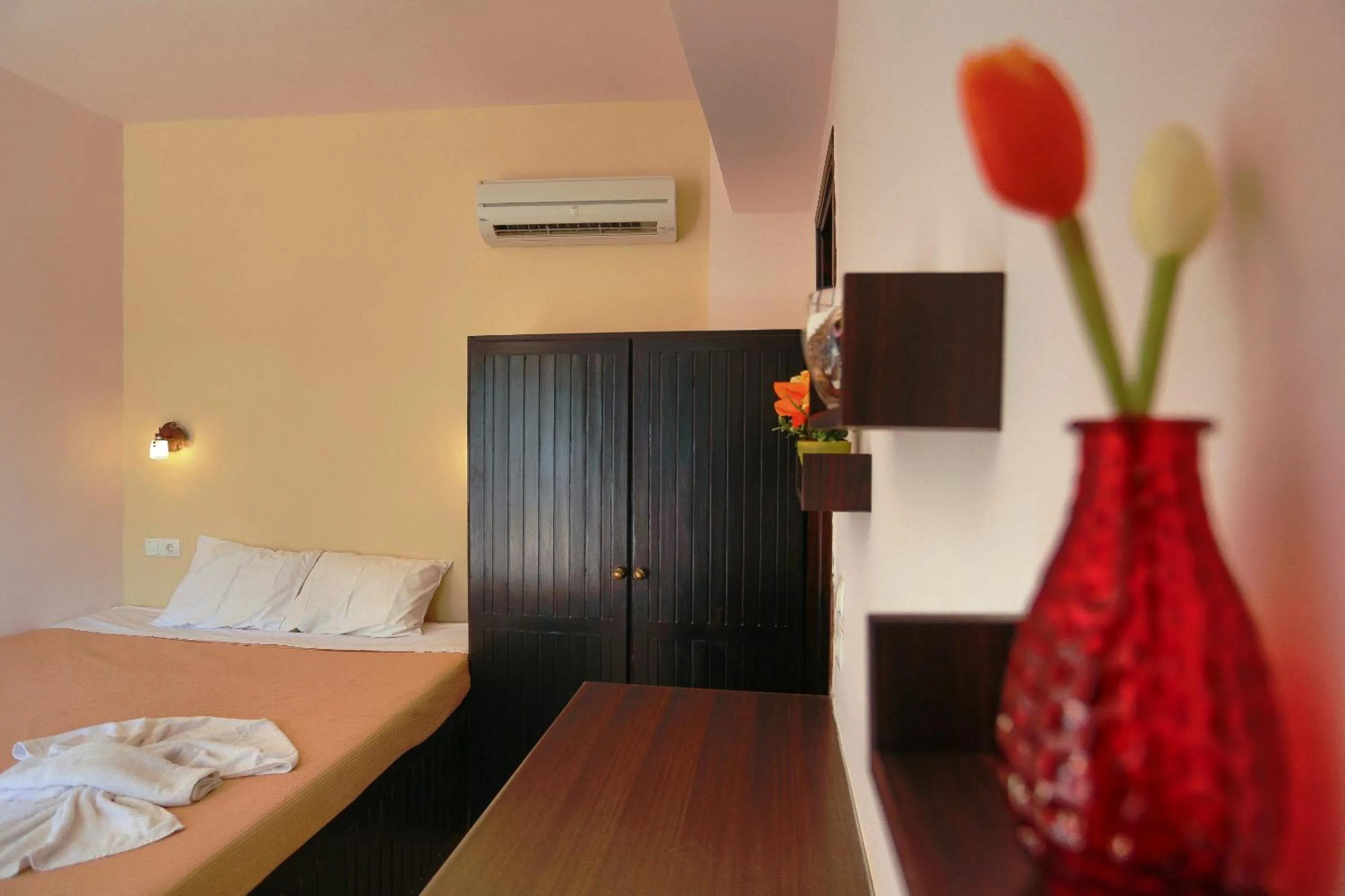 Bed in Little Lindos Sea View Studios