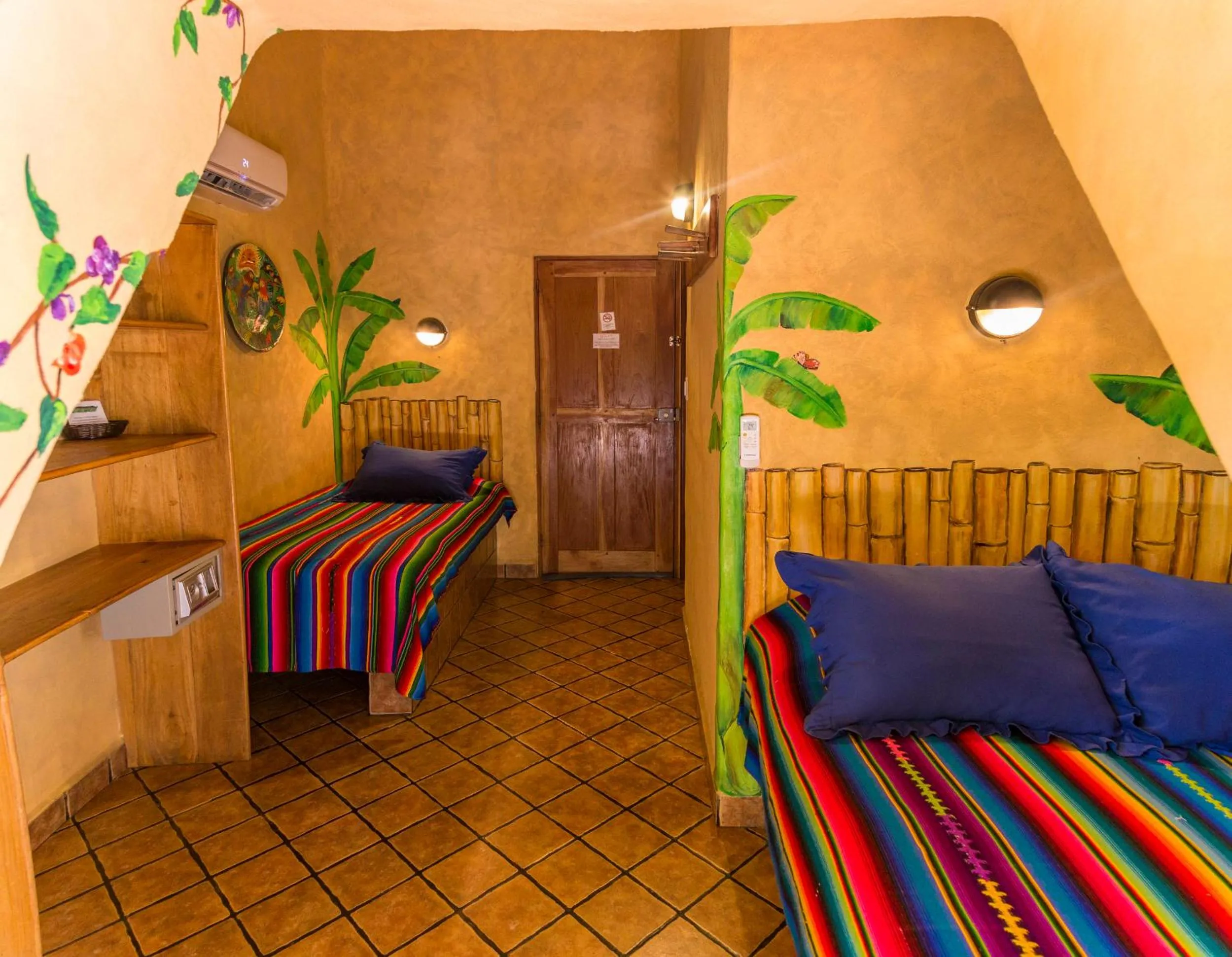 Bed in El Sano Banano Beachside Hotel