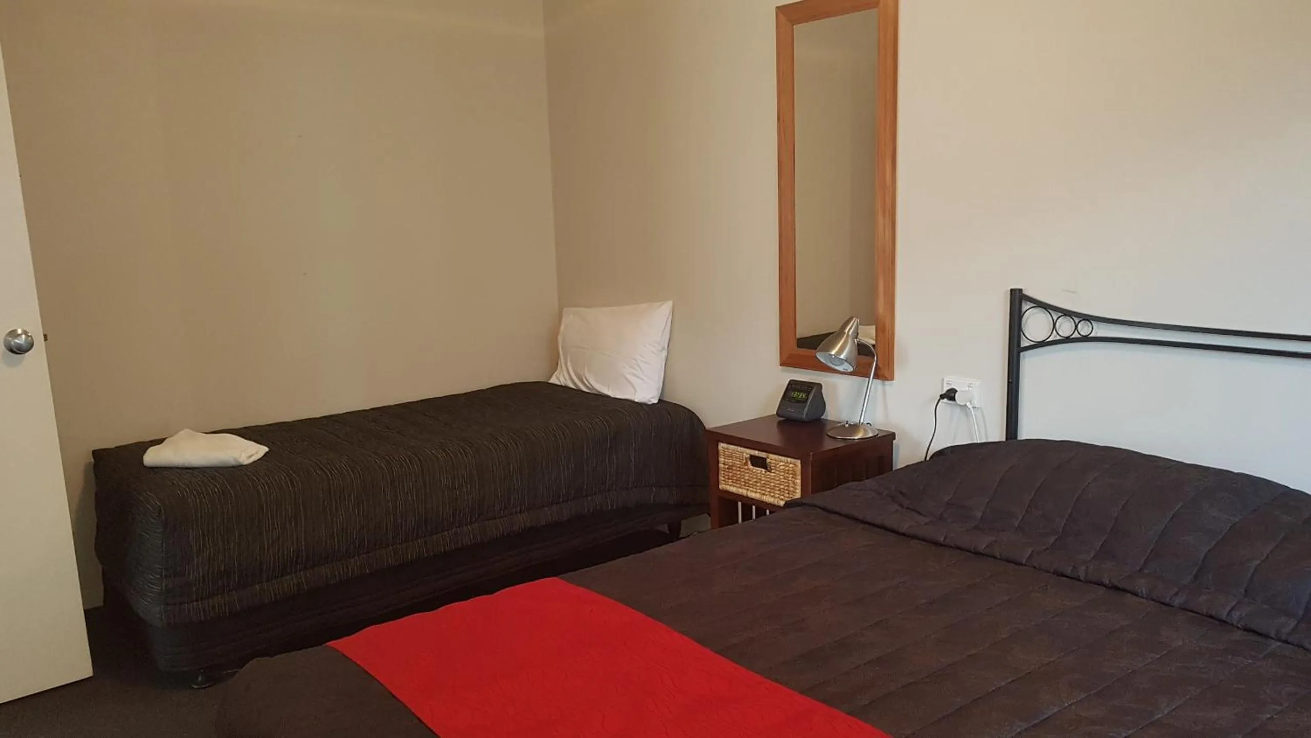 Bed in Palm Court Motel