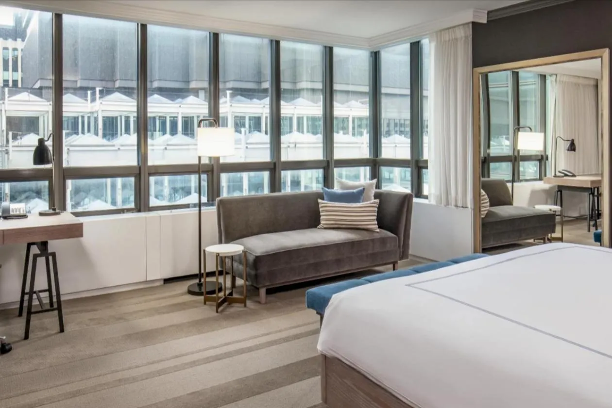 Living room, Bed in The Marquette Hotel, Curio Collection by Hilton