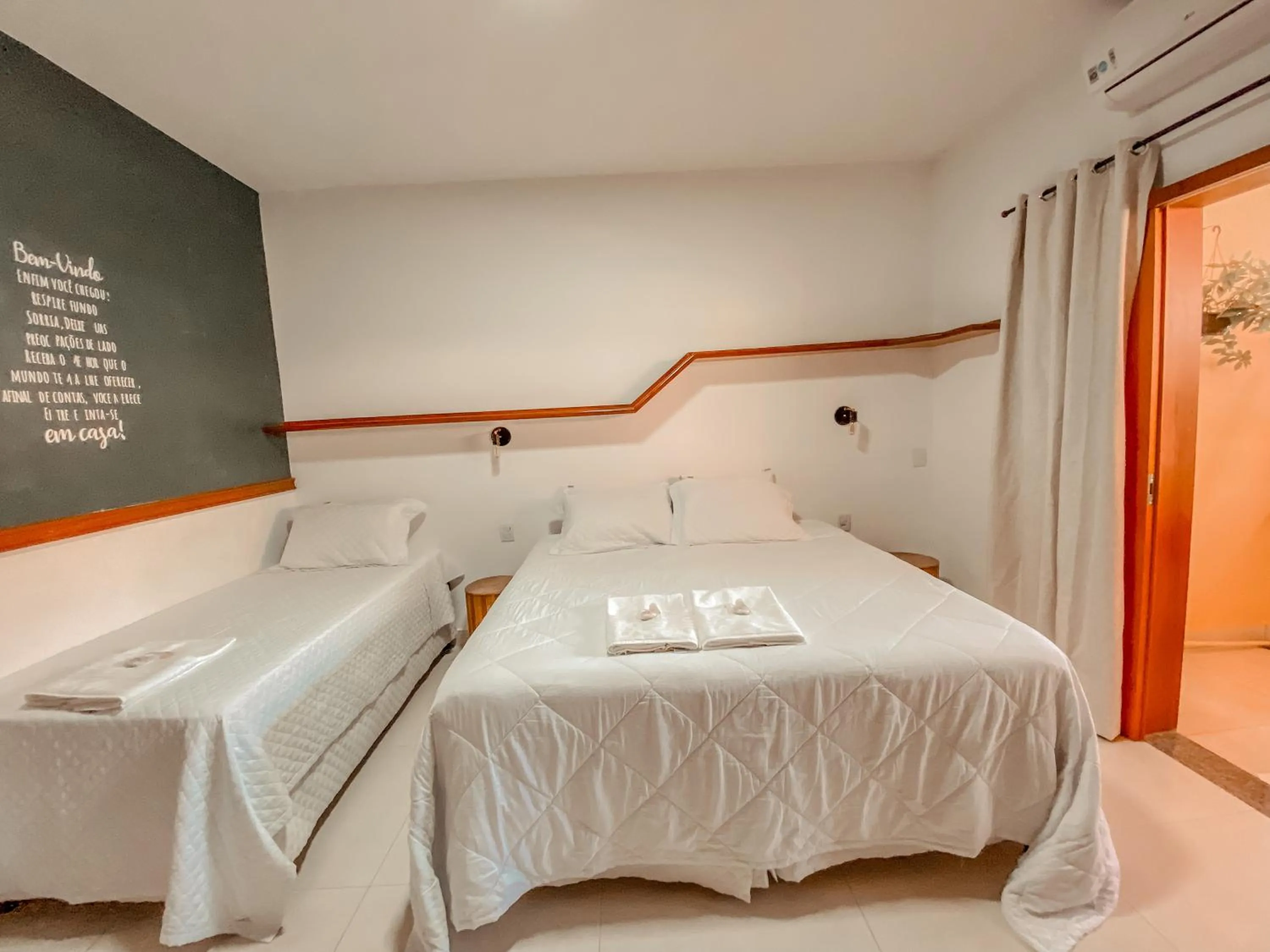 Photo of the whole room, Bed in Pousada Quintal da Lua