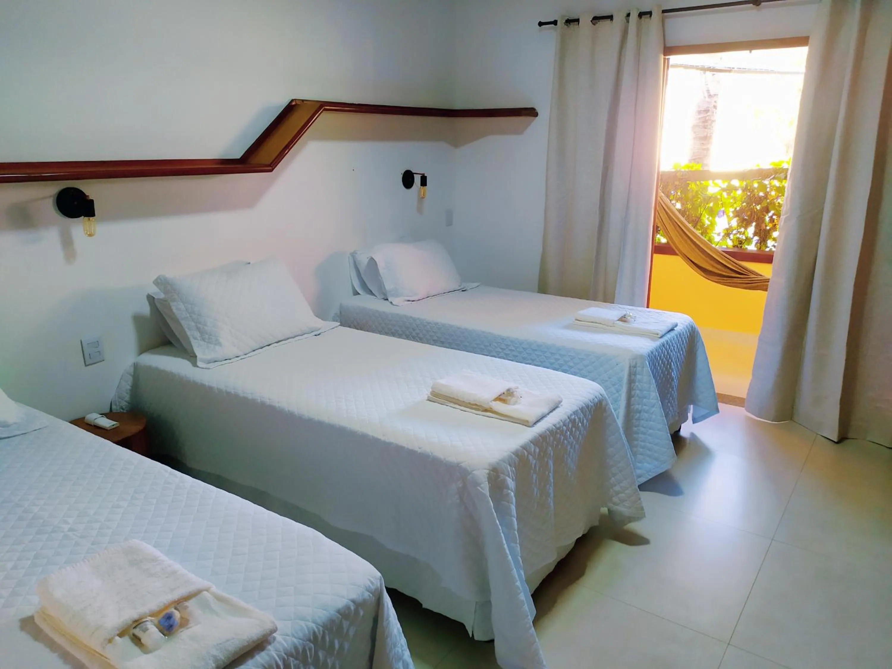 Photo of the whole room, Bed in Pousada Quintal da Lua
