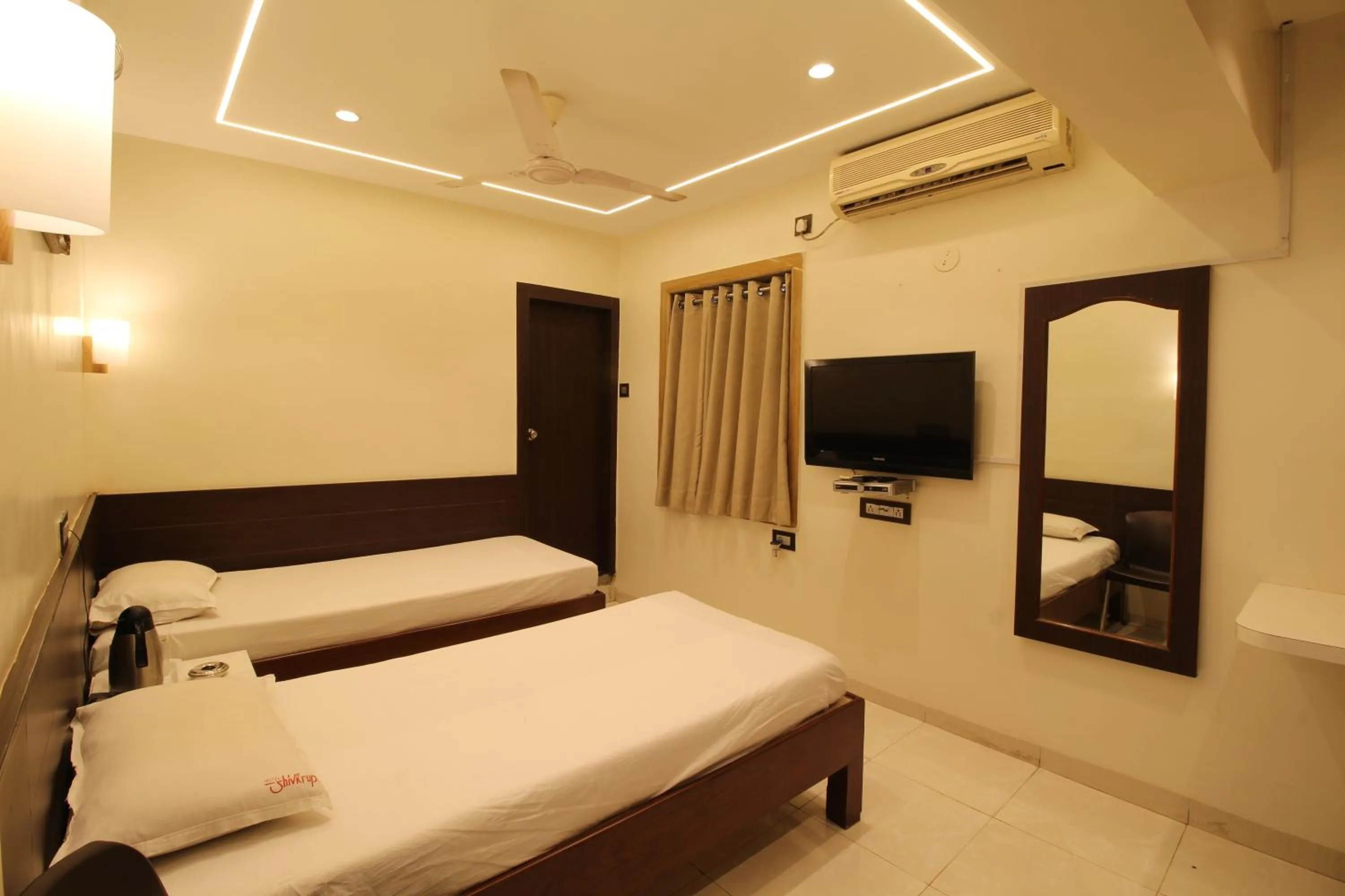 Photo of the whole room, Bed in Hotel Shivkrupa