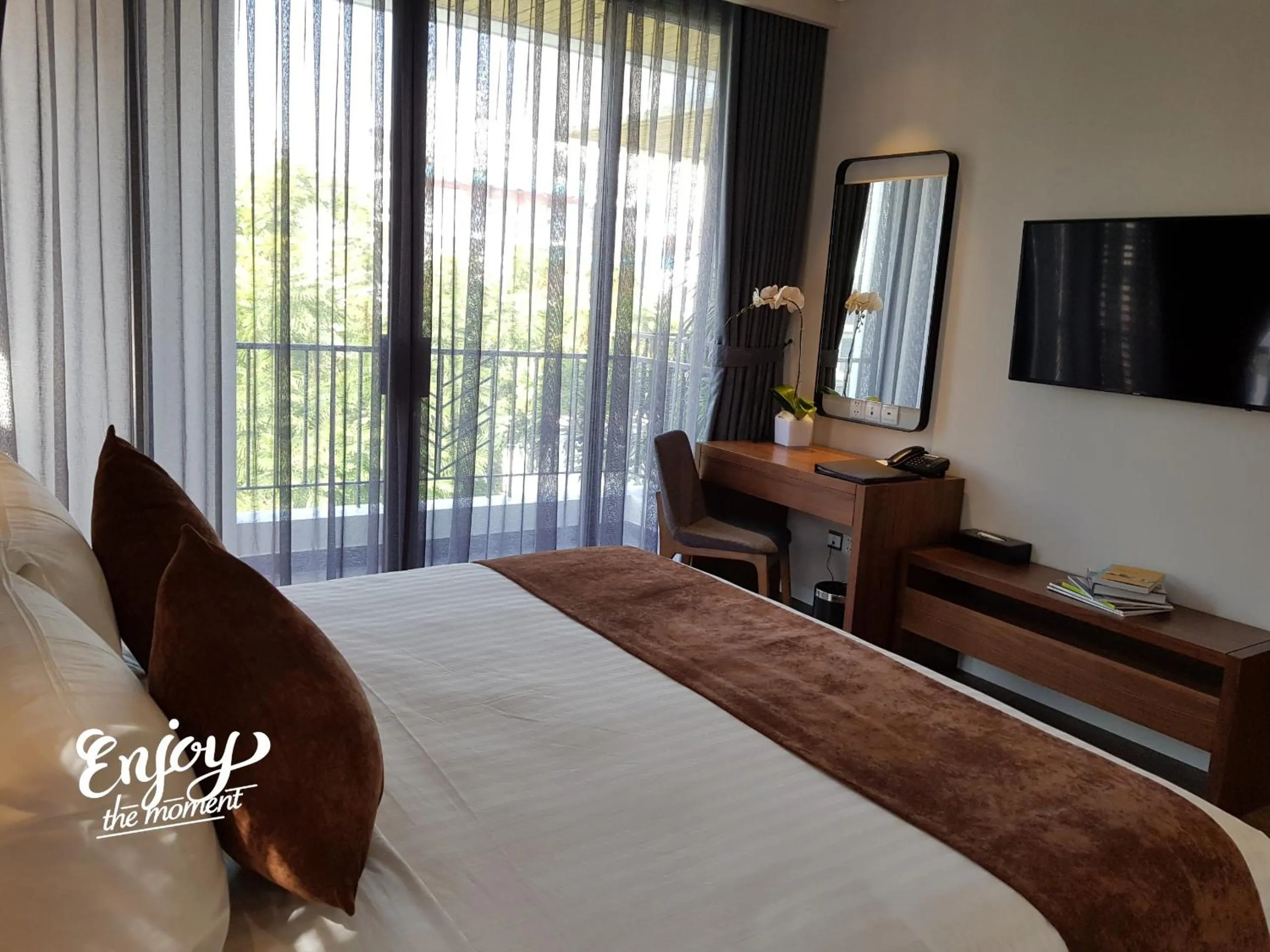 Bed in Orchid Boutique Hotel & Apartment