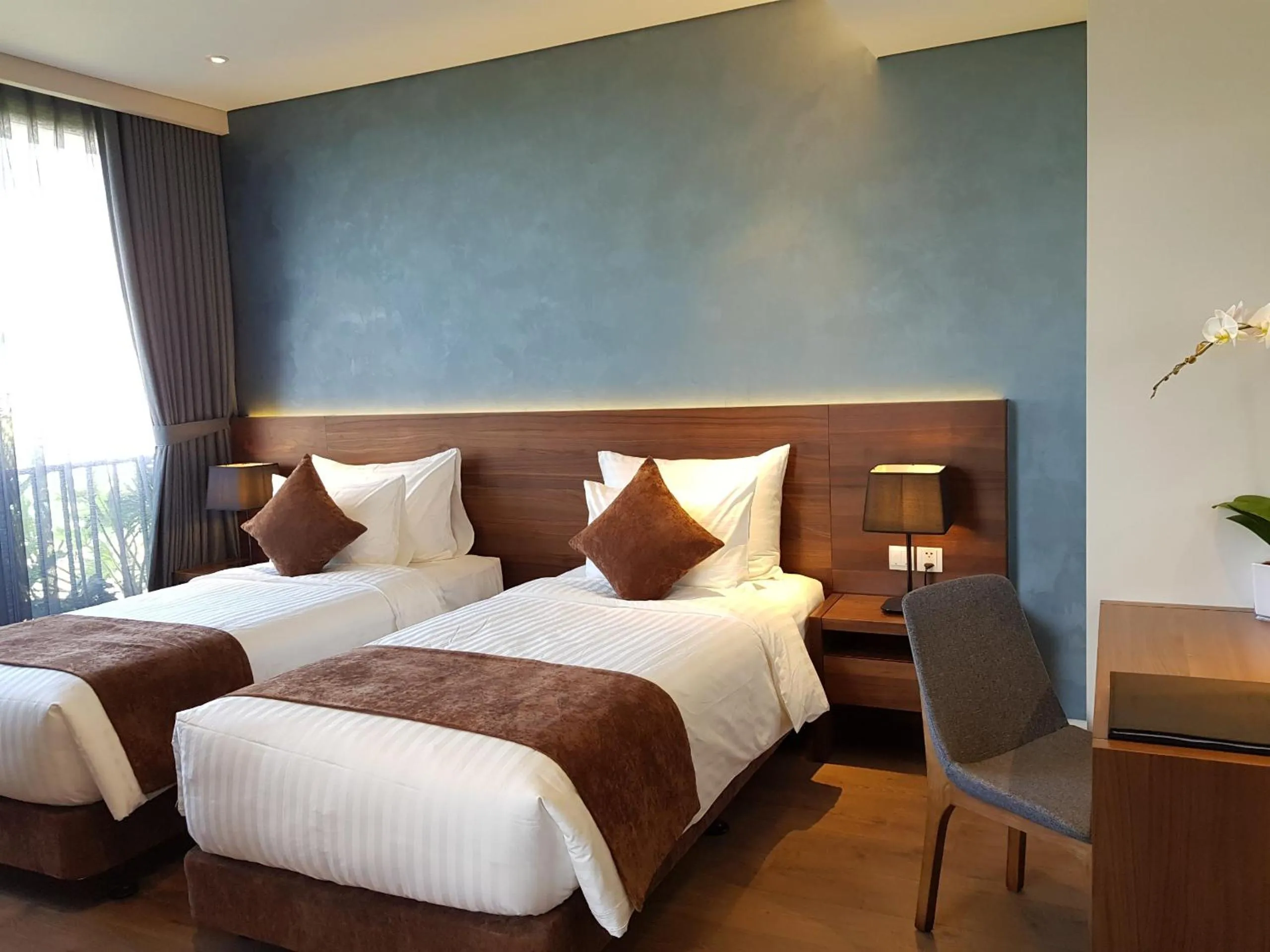 Bed in Orchid Boutique Hotel & Apartment