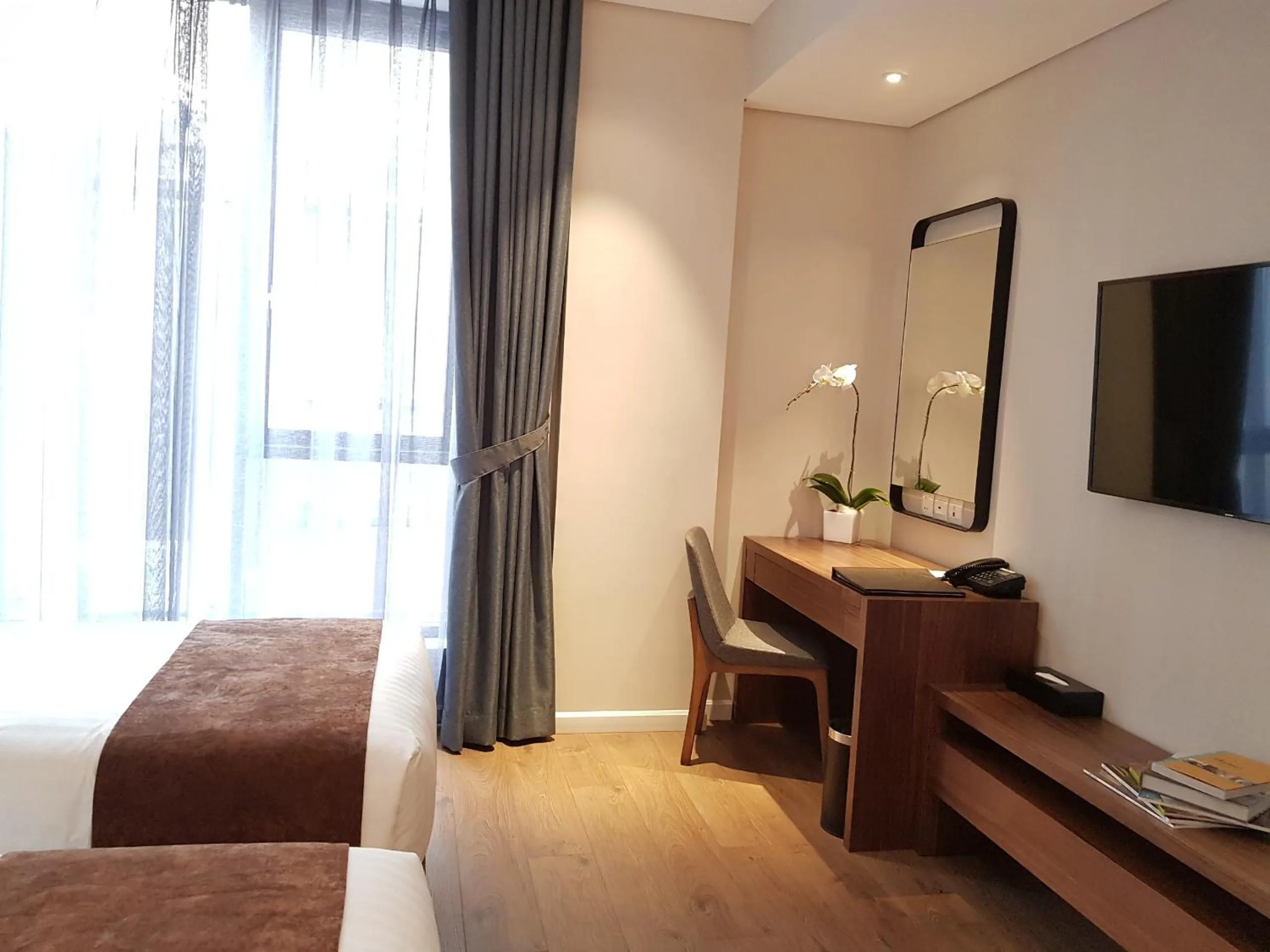 Bed in Orchid Boutique Hotel & Apartment