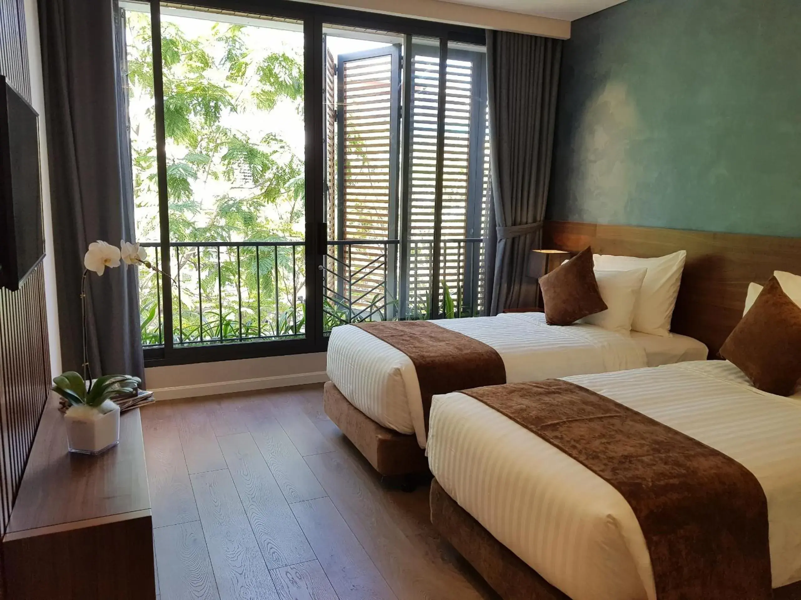 Bed in Orchid Boutique Hotel & Apartment Bed in Orchid Boutique Hotel & Apartment