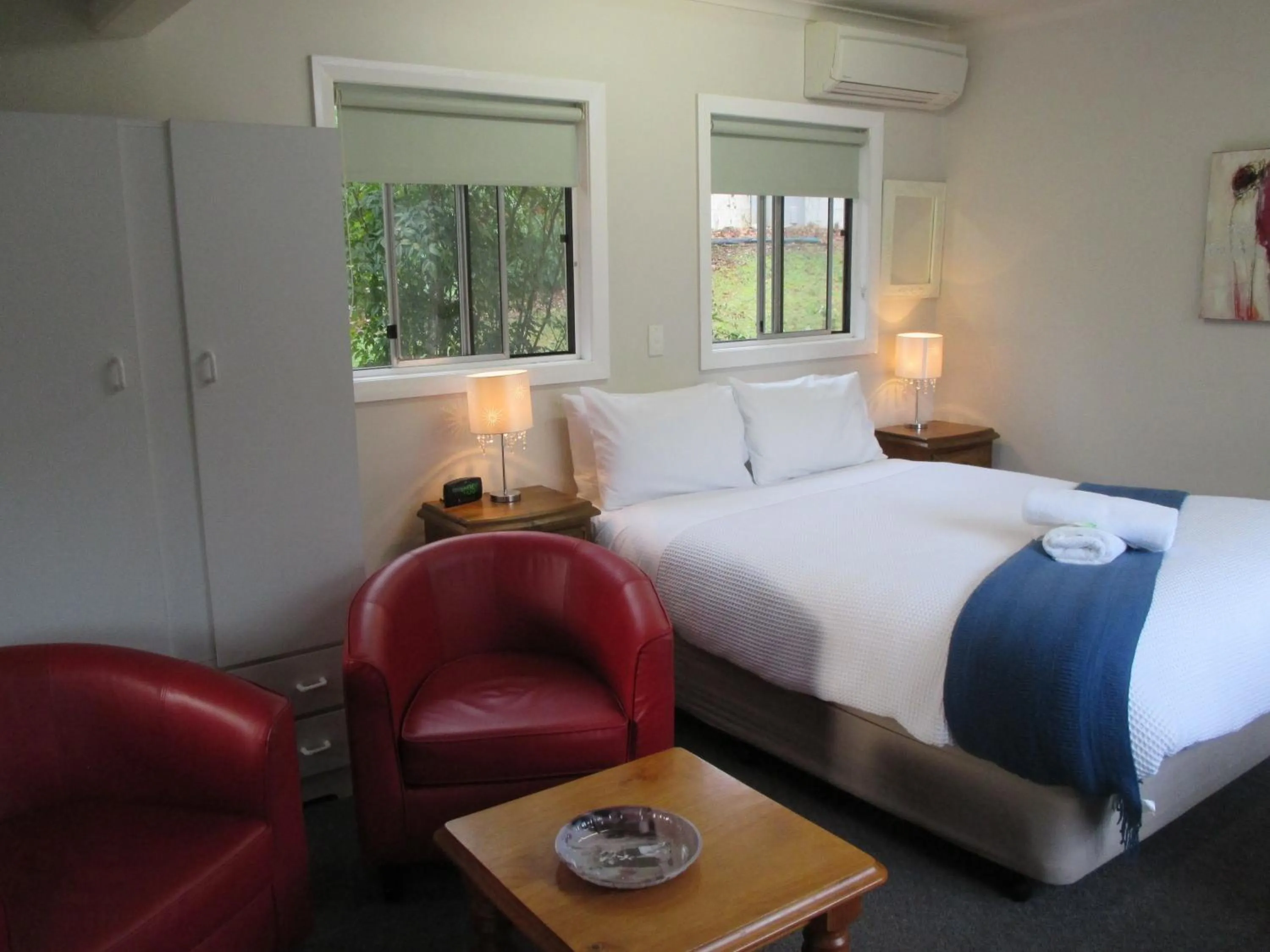 Bed in Alpine Riverside Cottages