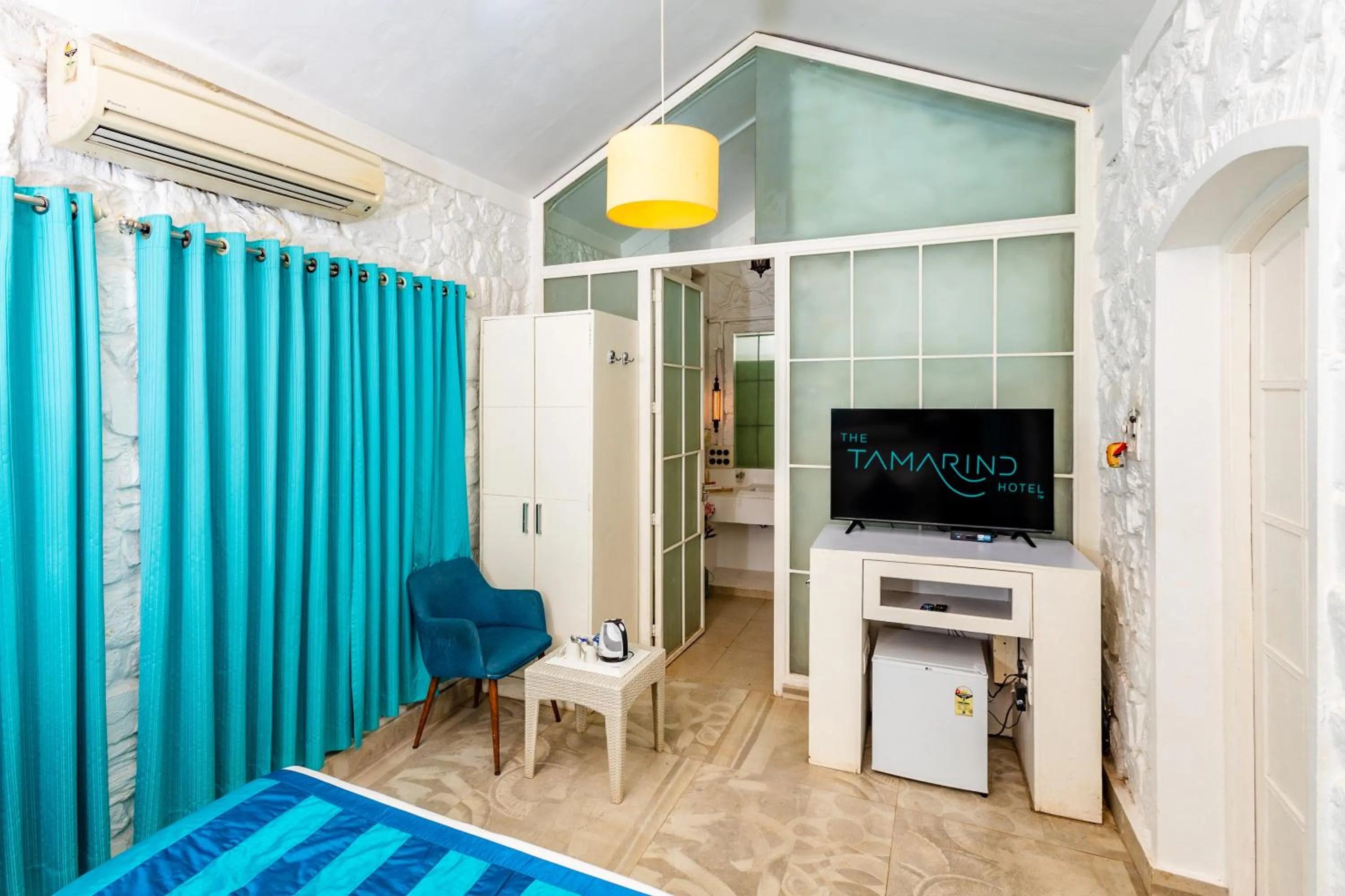 TV and multimedia, Bed in The Tamarind Hotel - A Boutique Heritage Stay, Anjuna - Goa