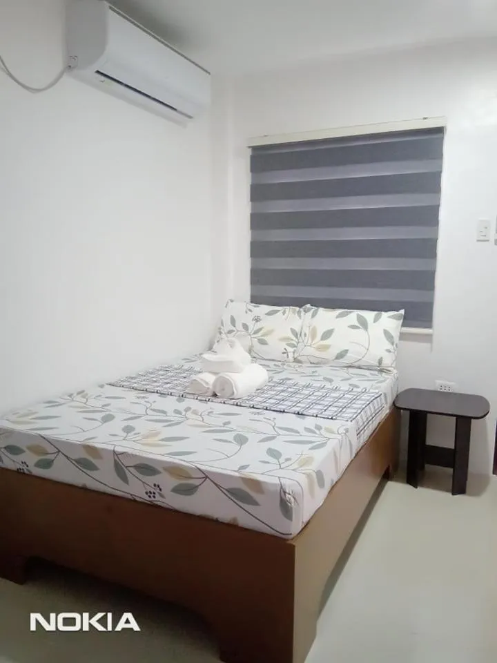 Bed in Grae’s Apartelle