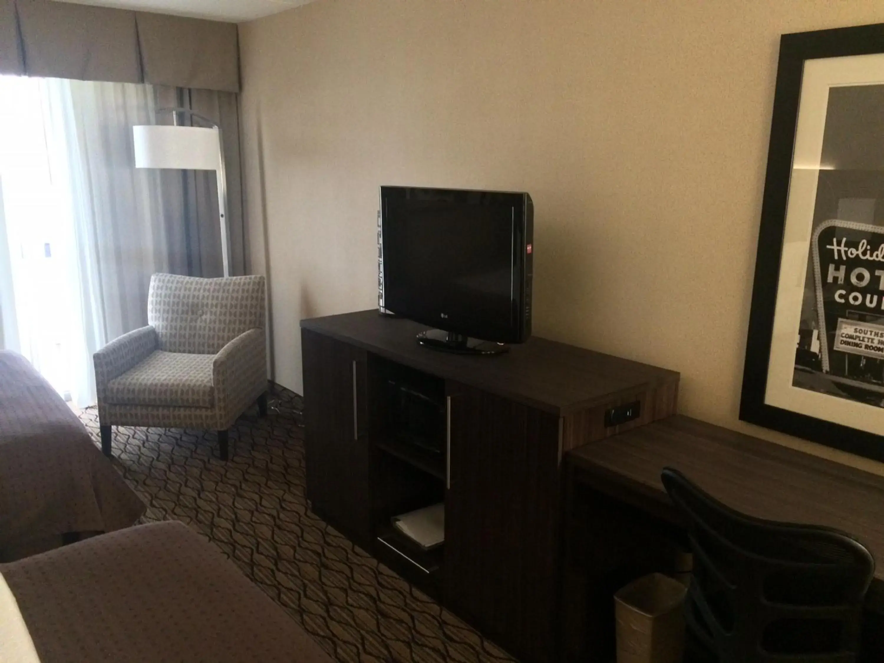 Photo of the whole room, TV/Entertainment Center in The Riverside Plaza Hotel