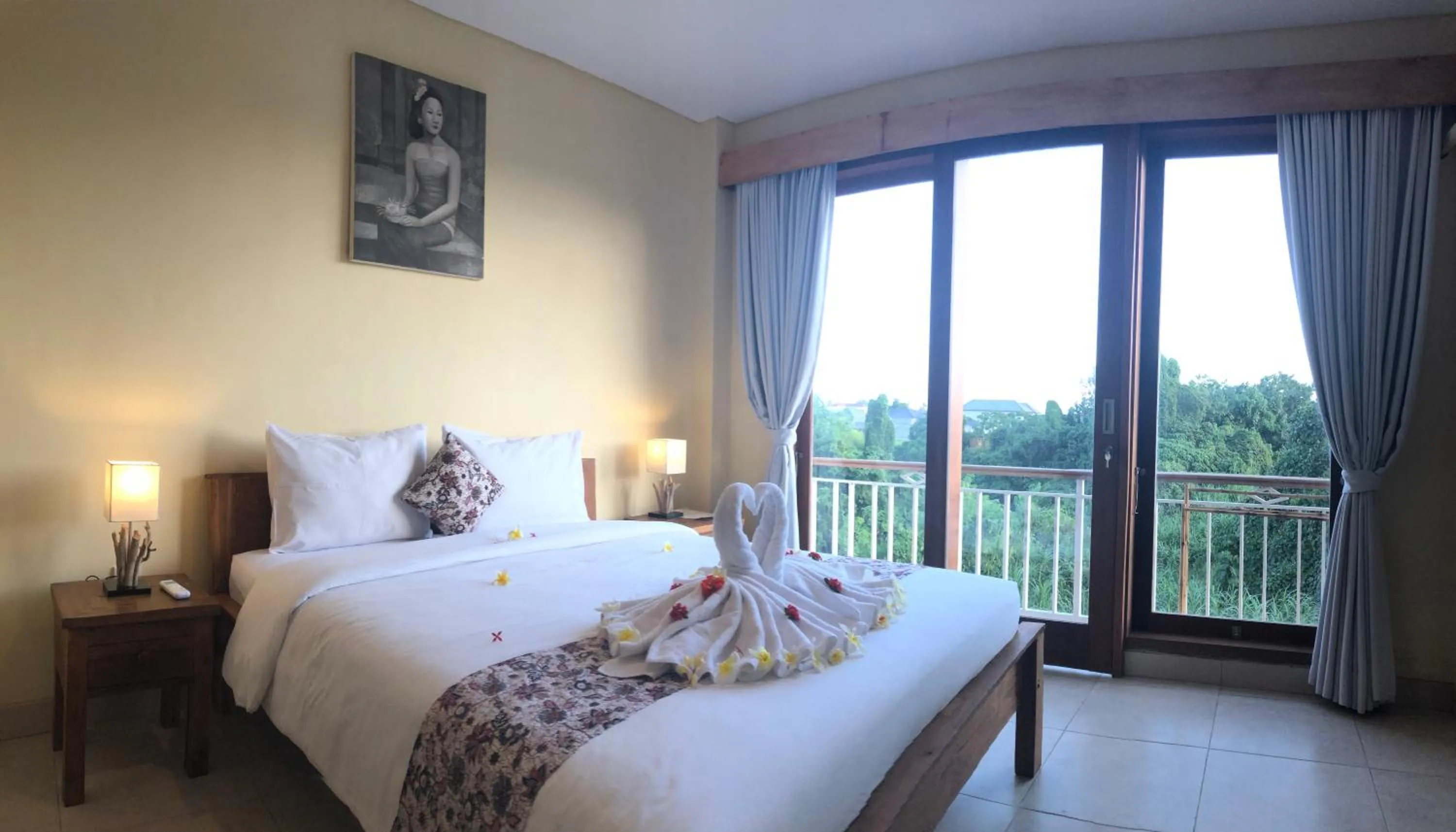 Bed in Oka's Guest House Canggu