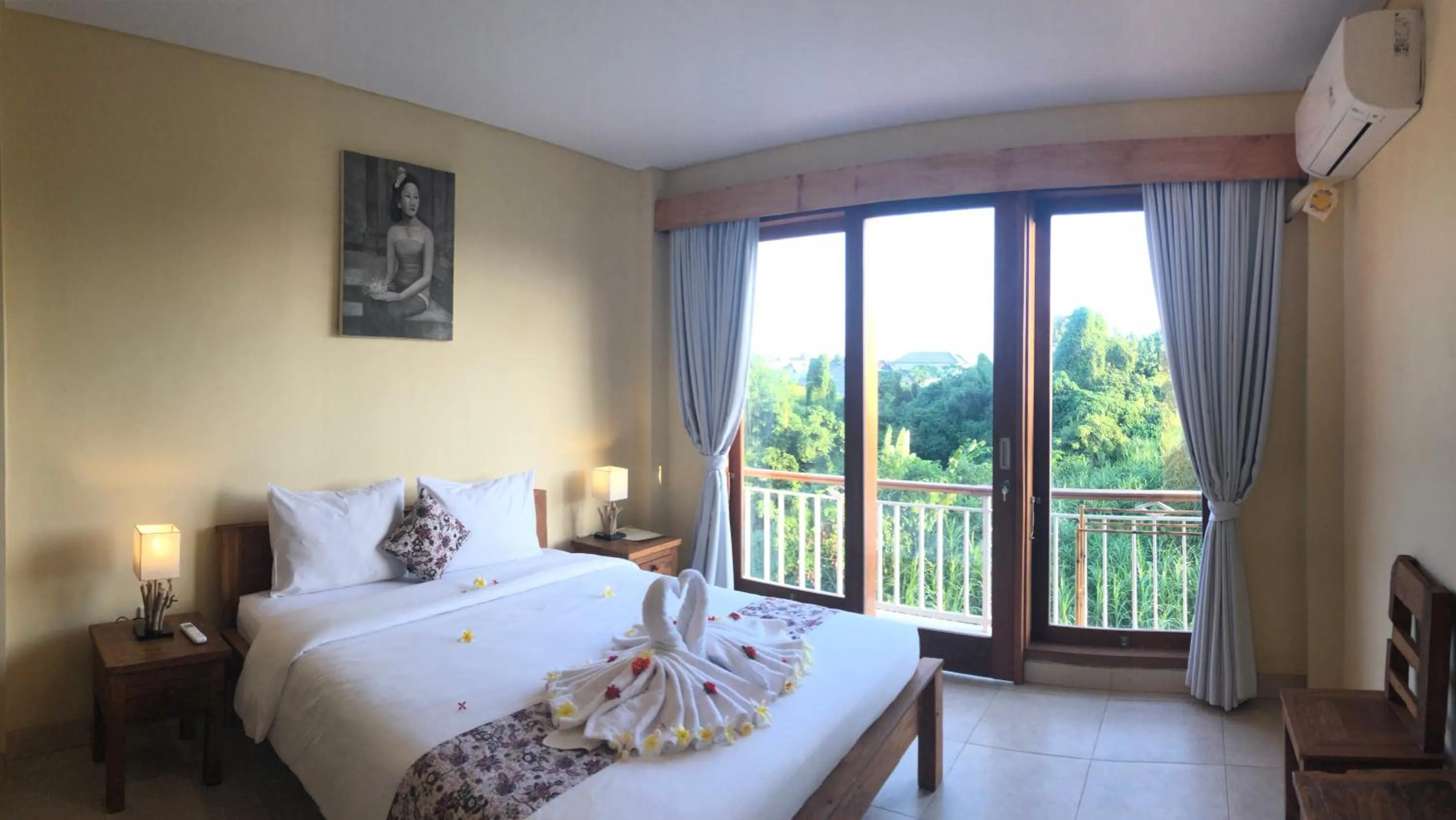 Bed in Oka's Guest House Canggu