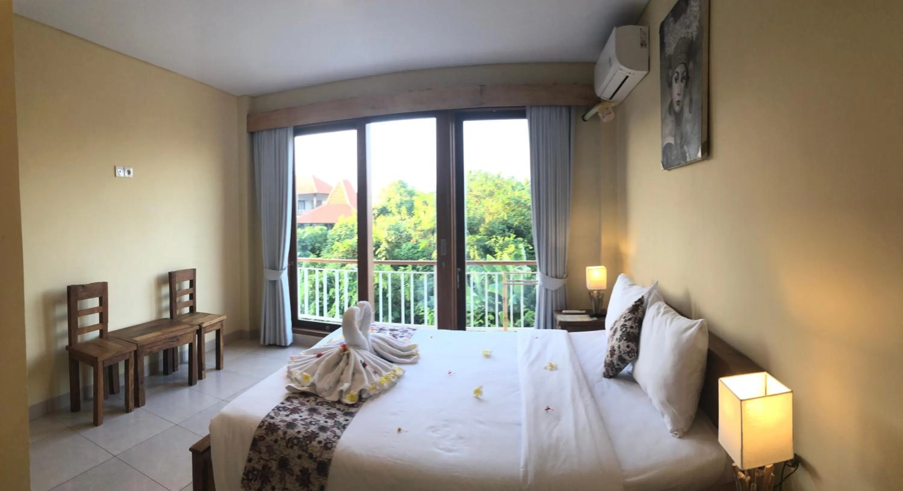 Bed in Oka's Guest House Canggu