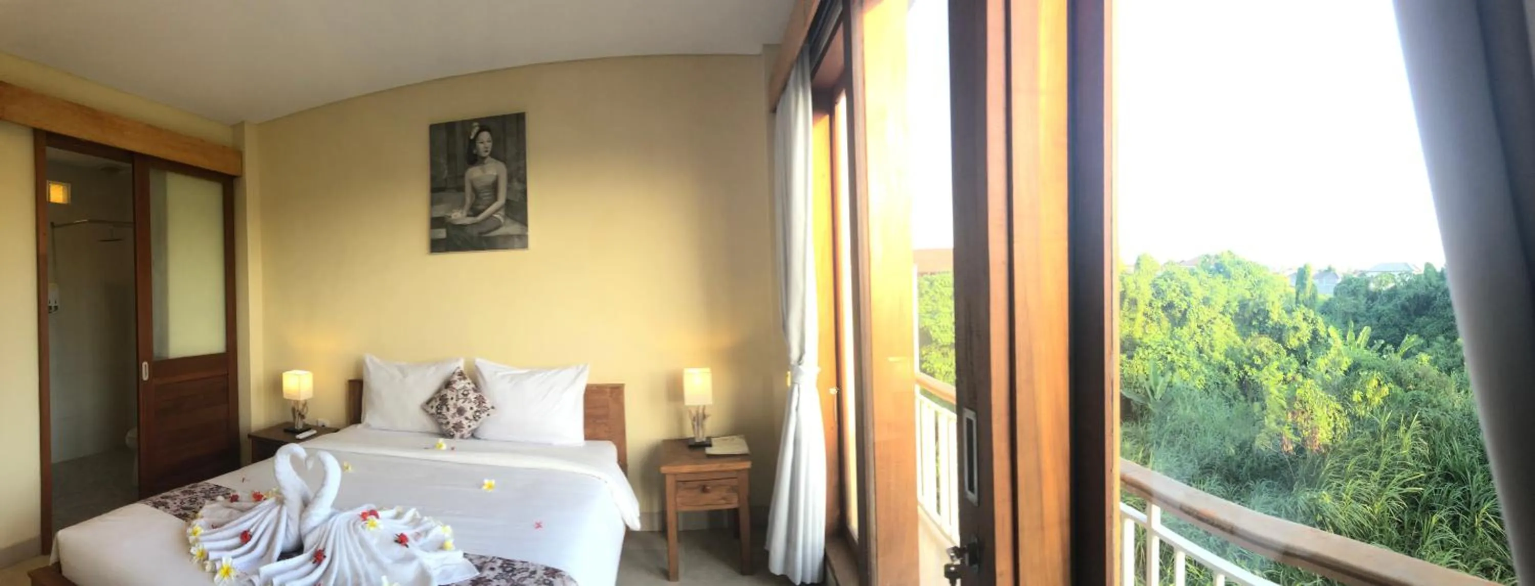 Bed in Oka's Guest House Canggu