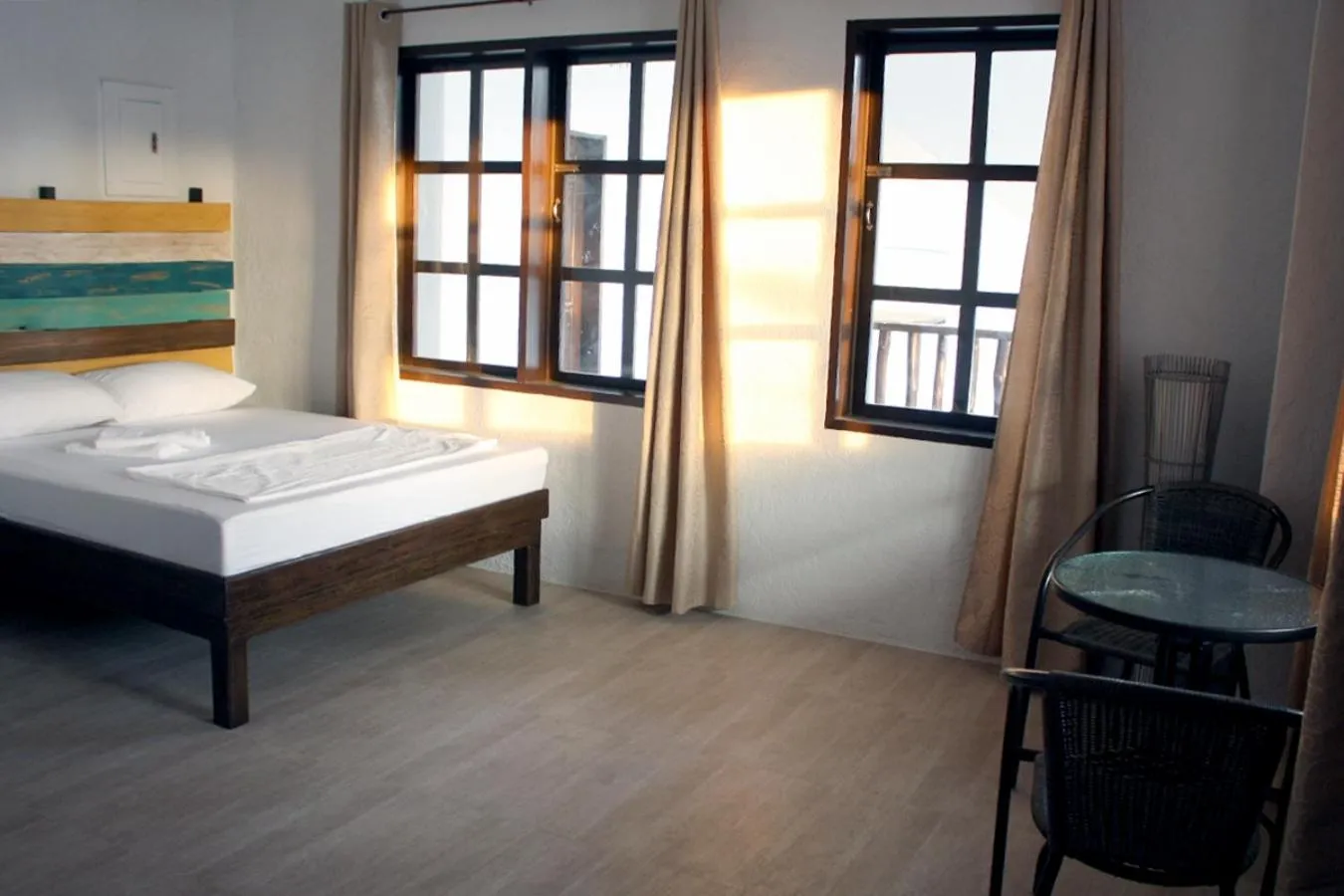 Living room, Bed in Sentro Suites Siargao