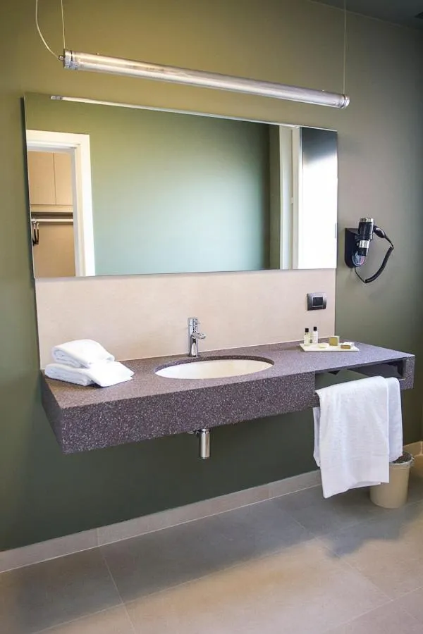 Bathroom in Zara Rooms & Suites
