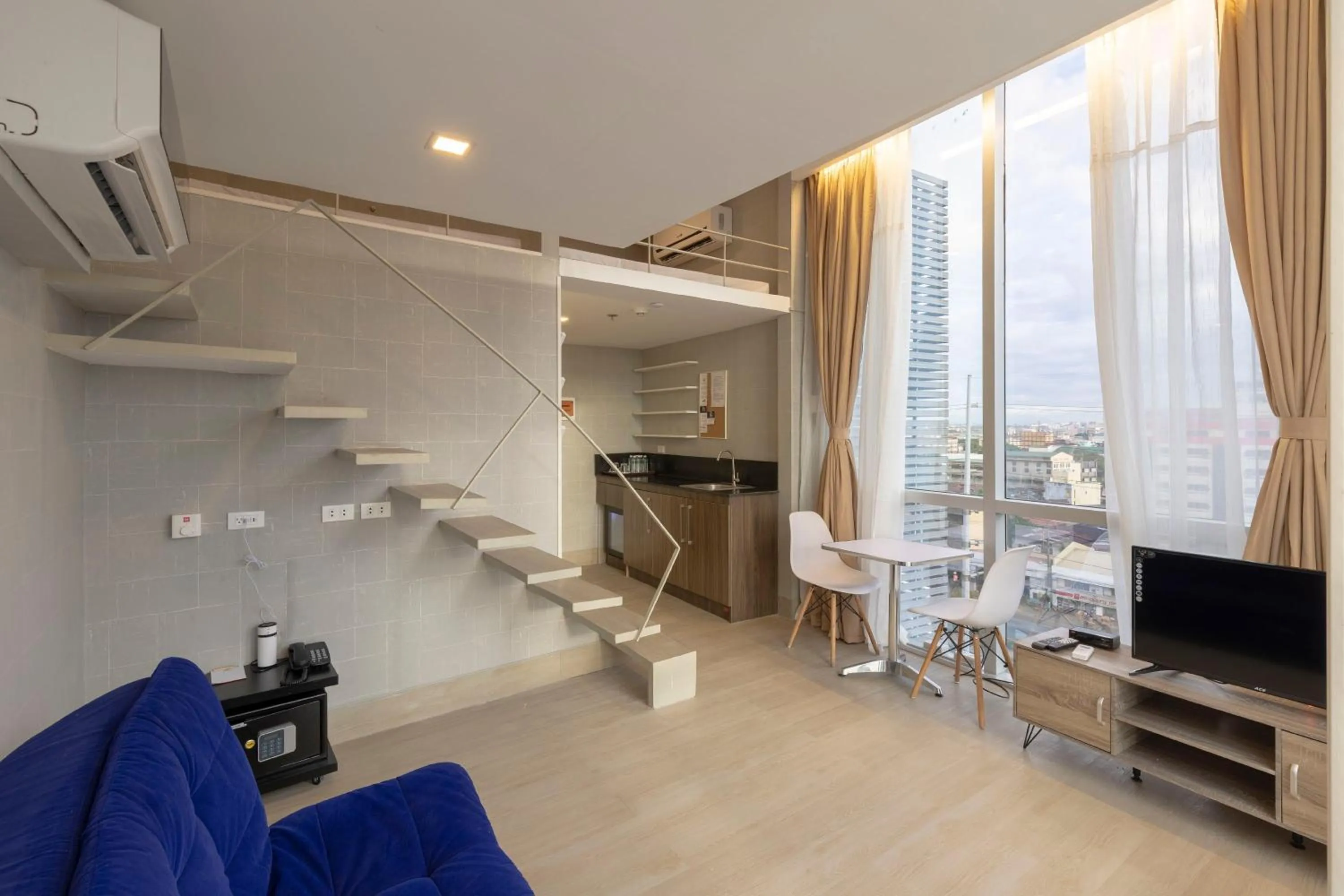 Seating area in Selah Pods Hotel Manila