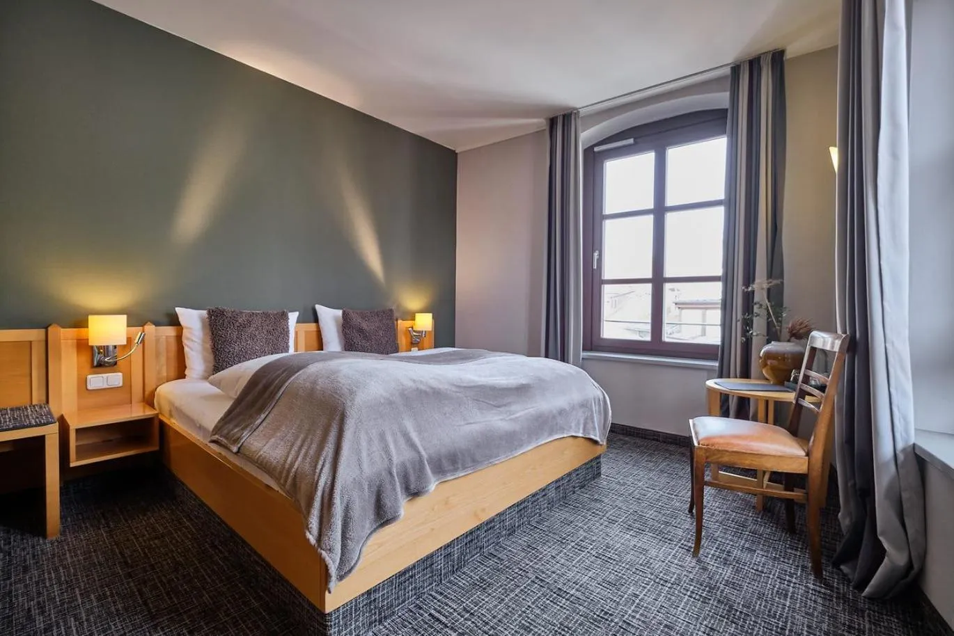 Bed in Hotel Roter Hahn