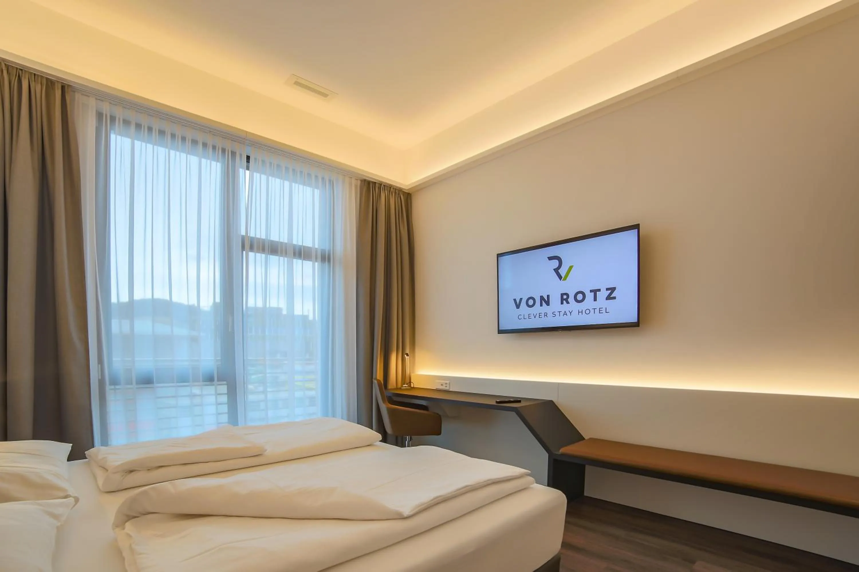 Bed in Self Check-in Hotel von Rotz