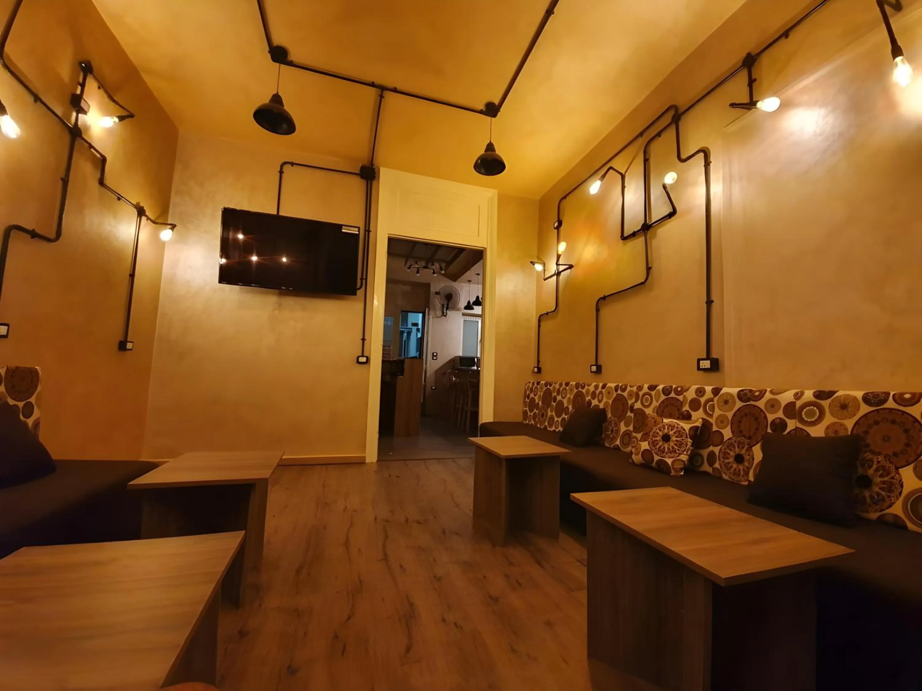 Communal lounge/ TV room in Holy Sheet Hostel